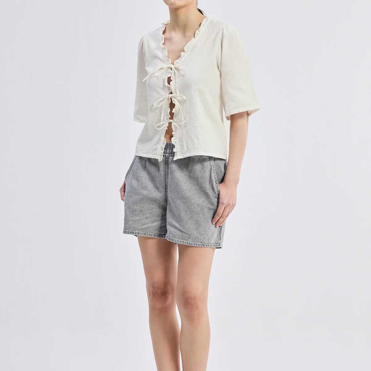 Relaxed Fit Top With Ruffles and Front-Ties in Cream | Reistor