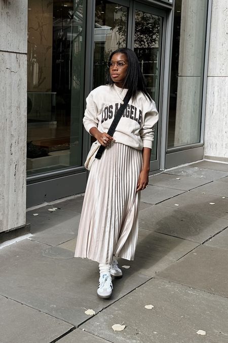 Oversized sweatshirt pleated skirt casual fall outfit Wearing medium top and XS skirt 

#LTKstyletip #LTKfindsunder100