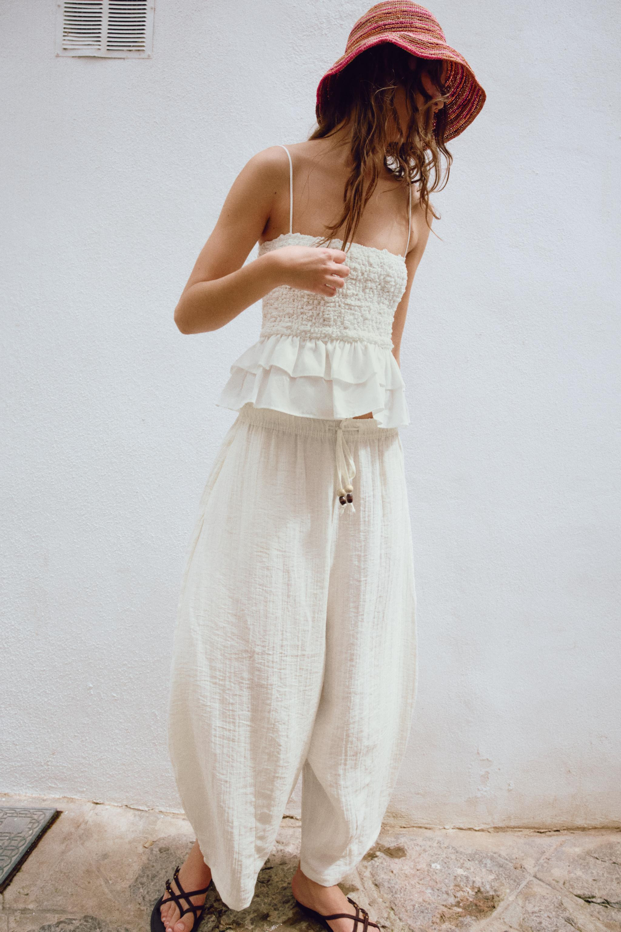 DescriptionContentsMeasurementsTop with straight neckline and spaghetti straps. Elastic smocking.... | Zara US