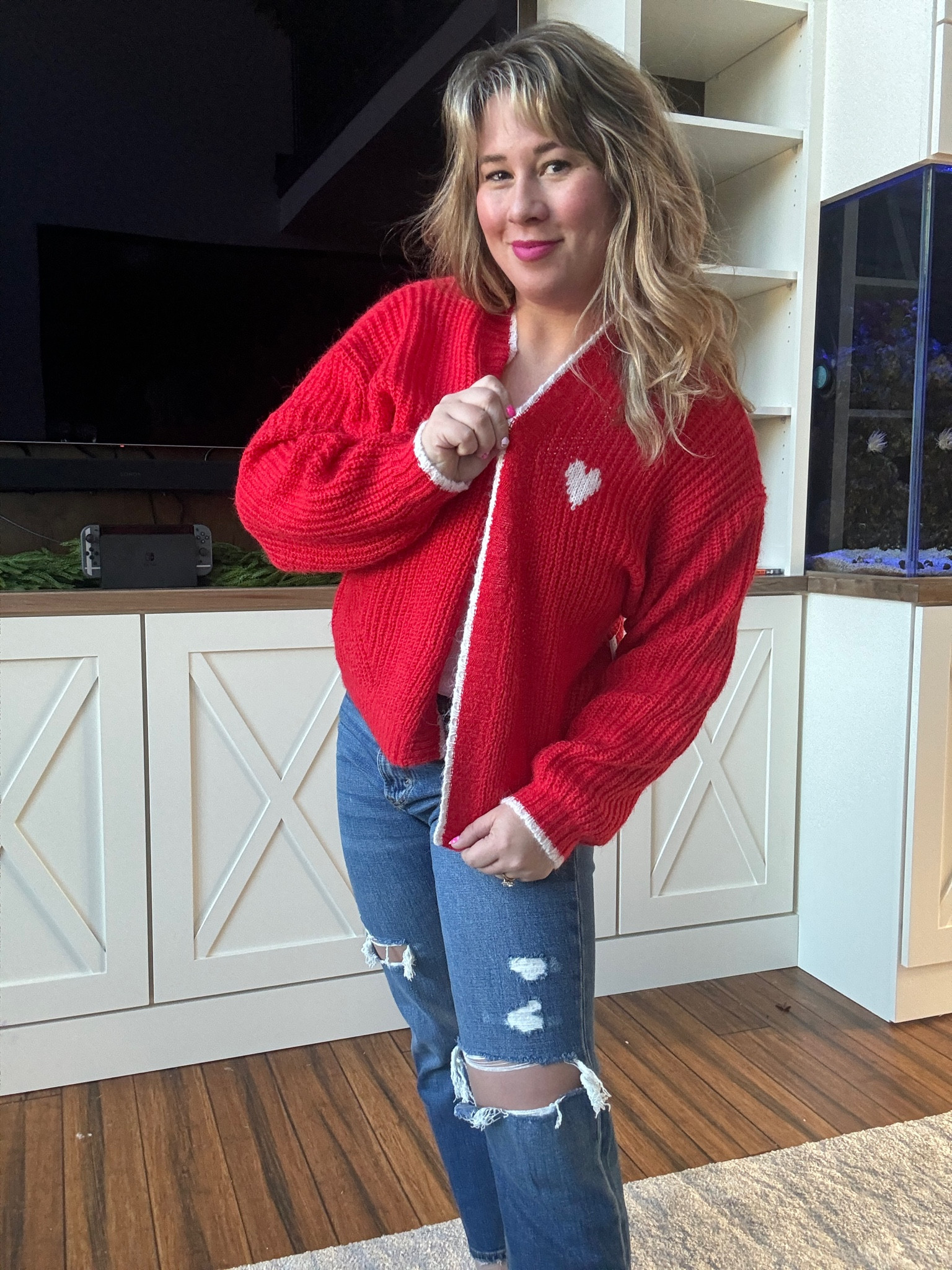 The cutest red heart cardigan for Valentine’s Day! Wearing a small 

Valentine’s Day. Petite style. Cardigan. Red sweater. Winter cardigan. Size small. Size 6. Mom style. Holiday outfit. 

#LTKfindsunder50 #LTKstyletip #LTKSeasonal