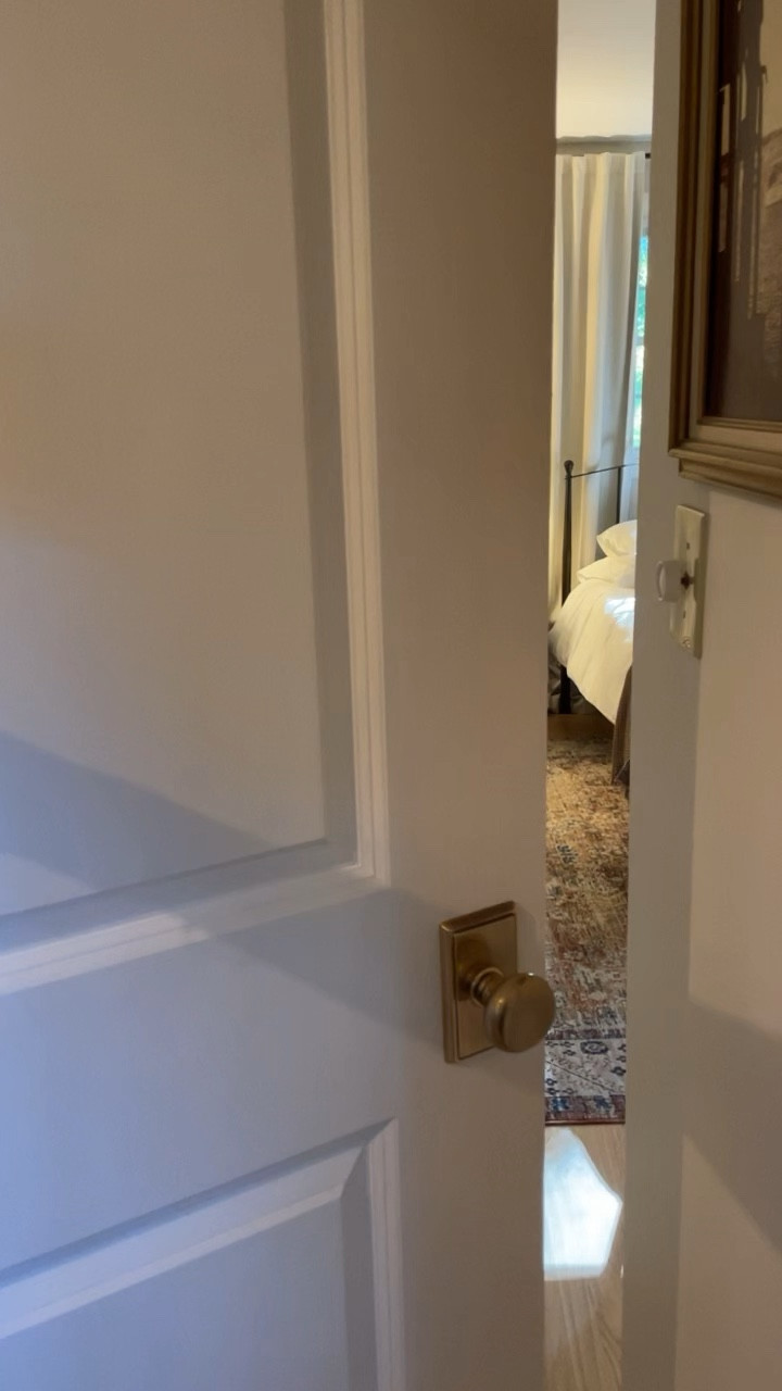 Guest bedroom retreat. Details that helped elevate this space: French antique brass doorknobs, luggage racks, and welcome basket 🤎