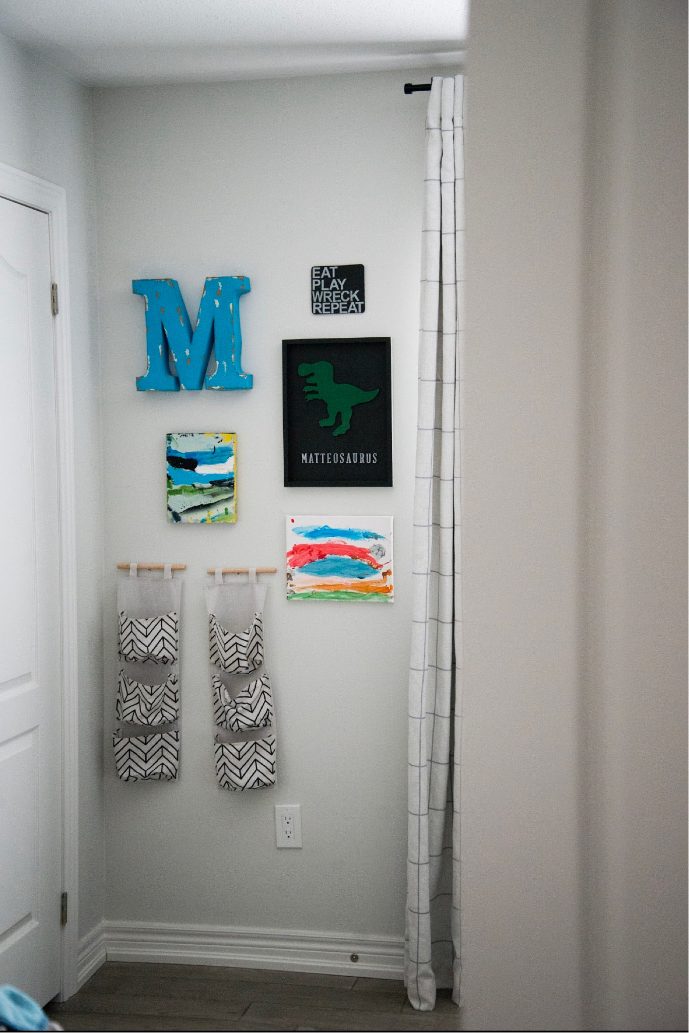 Gallery wall for little boys room including his own art on wood canvas frames, a large aluminum initial letter, clothes storage hanging baskets and checkered linen blackout curtains  

#LTKkids #LTKhome #LTKFind