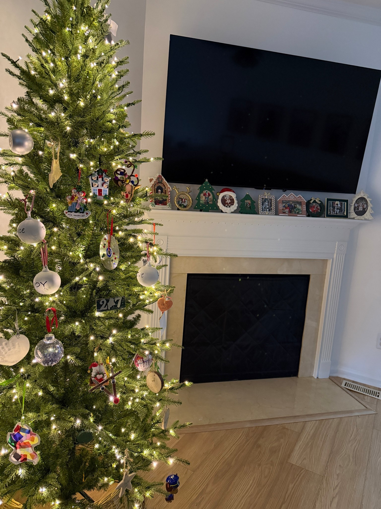 Our new favorite holiday decor tradition is family photos from that holiday in seasonal frames on the mantel! Including what frames I can link & our Christmas tree 🎄 we got the slim! 

#LTKHome #LTKSeasonal #LTKHoliday