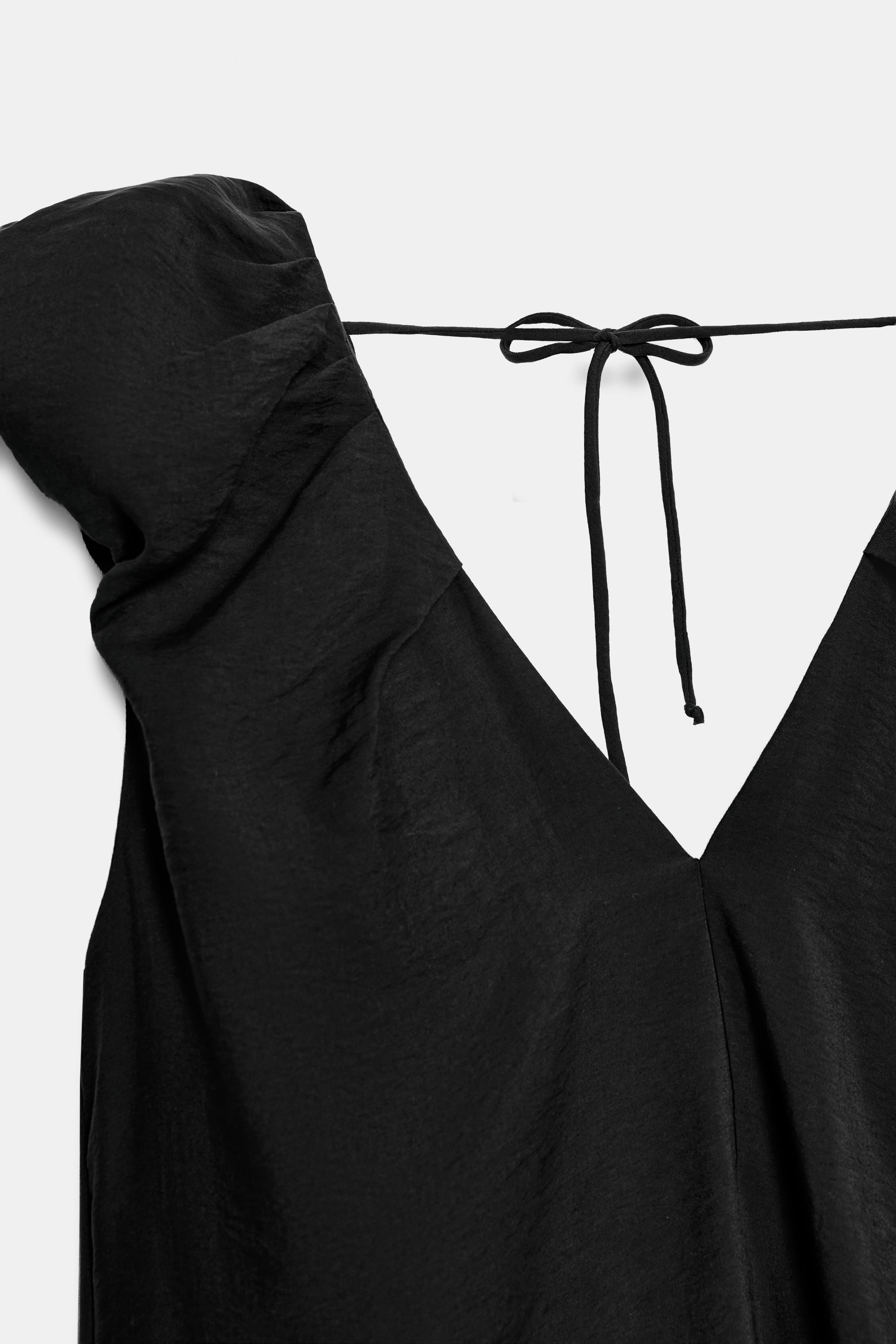 Loose-fitting dress with a V-neckline at the front and back. Sleeveless with puff detail. Hidden ... | Zara US