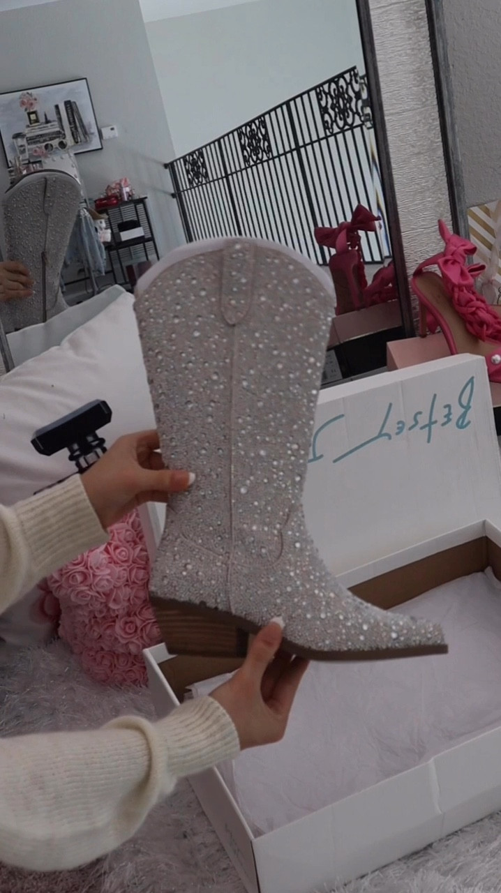 Rhinestone cowboy boots are definitely my kind of horsepower 🤍 just got in the mail and had to take them out for a ride! Obsessed with all the rhinestones, @betseyjohnson always does amazing work. Everything I’m wearing is linked for you girls to shop ✨ Xoxo, Lauren 

rhinestone cowboy boots, rhinestone boots, rhinestone western boots, booties, white skirt, linen button down shirt, rhinestone purse, rhinestone bag, western style, cowboy style, western chic outfit, dyson airwrap hairstyle, amazon fashion finds, amazon style, amazon fashions, betsey Johnson shoes, h&m finds 

Follow my shop @lovelyfancymeblog on the @shop.LTK app to shop this post and get my exclusive app-only content!

#liketkit #LTKFestival 
@shop.ltk #ltkparties #ltkitbag #ltkvideo #ltkshoecrush