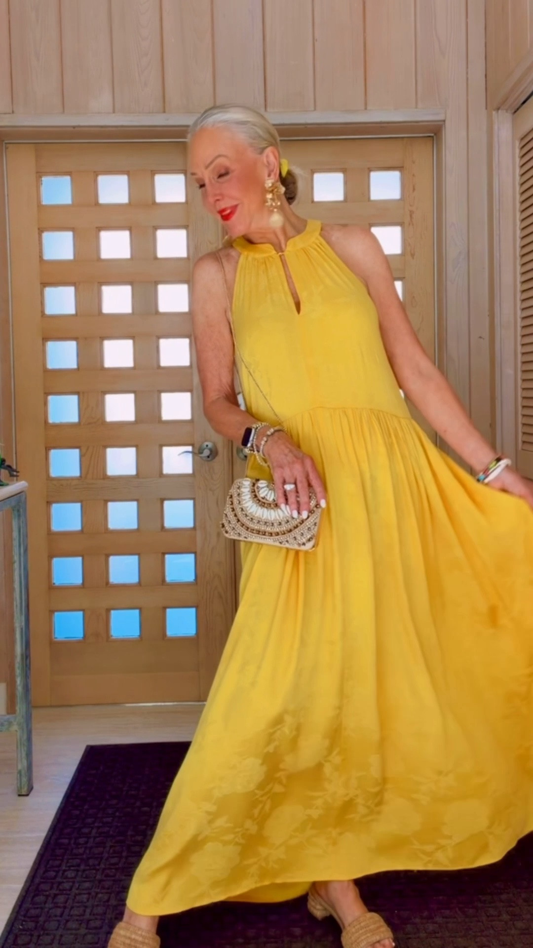Yellow floral jacquard halter midi dress. 

Raffia block heel slides
Madam Mink straw bag with orange bow 
Chico’s shell rattan clutch bag with long chain.
Statement flower earrings.
Stack stretch bracelets

#LTKWorkwear #LTKOver40 #LTKootd