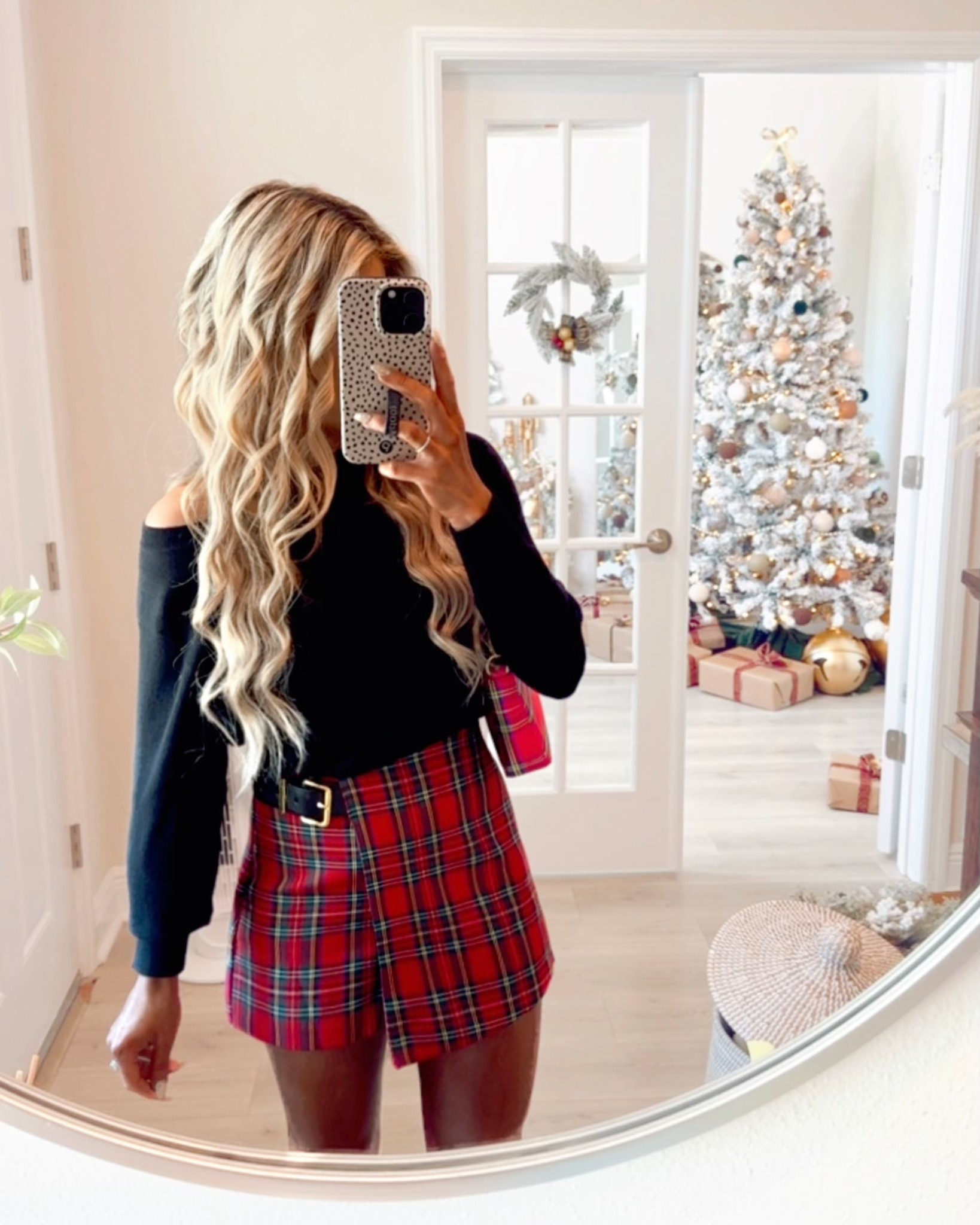 Holiday Outfit styled with a cozy off-the-shoulder black sweater, red tartan plaid skirt, matching tartan plaid bag, + bow heels. The plaid skirt is 25% OFF now!!!

Holiday party outfit, Christmas outfit, Christmas party outfit, holiday skirt, plaid skort, tartan skirt, Christmas skirt, holiday heels, holiday purse, 

#LTKSaleAlert #LTKootd #LTKHoliday