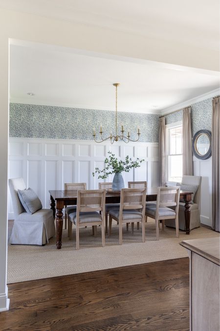 Blue floral wallpaper in dining room with lovely beige curtains, jute sisal rug, vane back chairs and brass chandelier  

#LTKSeasonal #LTKhome