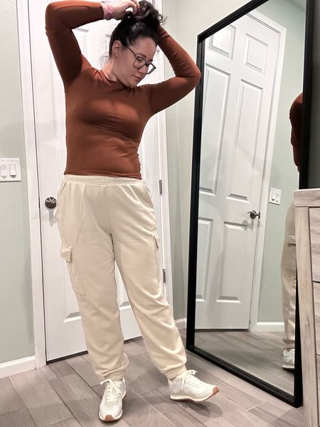 THIS fit is 100000%. It is comfy, neutral, and makes me feel amazing. I sized up in the shirt to an XL and the pants are a L. I could have sized down since they are a bit baggy, but so comfy. And I love these neutral sneakers too  

#LTKfindsunder50 #LTKmidsize #LTKstyletip