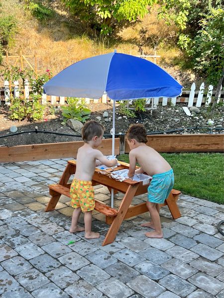 The coolest kids picnic table that includes an umbrella and sensory bin 😍☀️

#LTKfamily #LTKkids #LTKSeasonal
