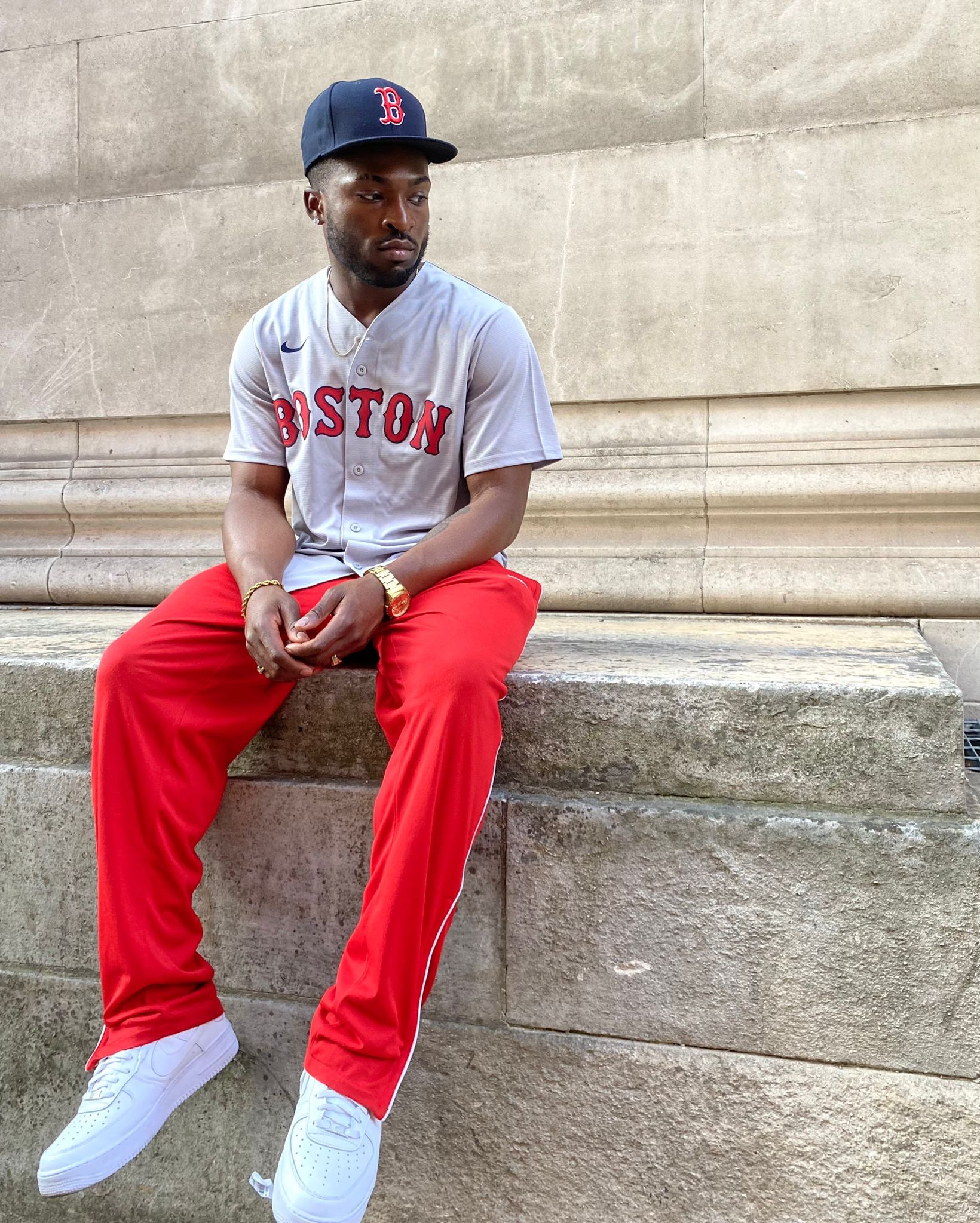 Red tracksuit bottoms with white panel, Boston jersey, cap, navy hat, white air forces, Nike 

#LTKeurope #LTKstyletip #LTKSeasonal