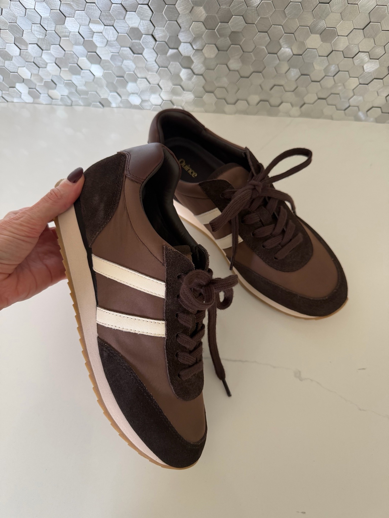 These Quince sneakers are such a chic find! I love the rich chocolate-brown mix of suede and smooth leather, plus the cream stripes give them a sporty vintage feel. They’ll look so cute with jeans, trousers, or a casual fall outfit. #Quince #QuinceSneakers #BrownSneakers #FallShoes #CasualChic #FallStyle #WomenOver40Style #LTKshoecrush #LTKOver40
 

 #LTKootd #LTKSeasonal #LTKOver40