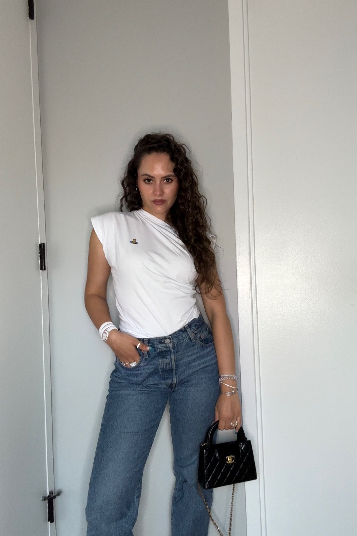 White off the shoulder top, blue jeans, black quilted crossbody bag

#LTKstyletip #LTKSeasonal #LTKeurope