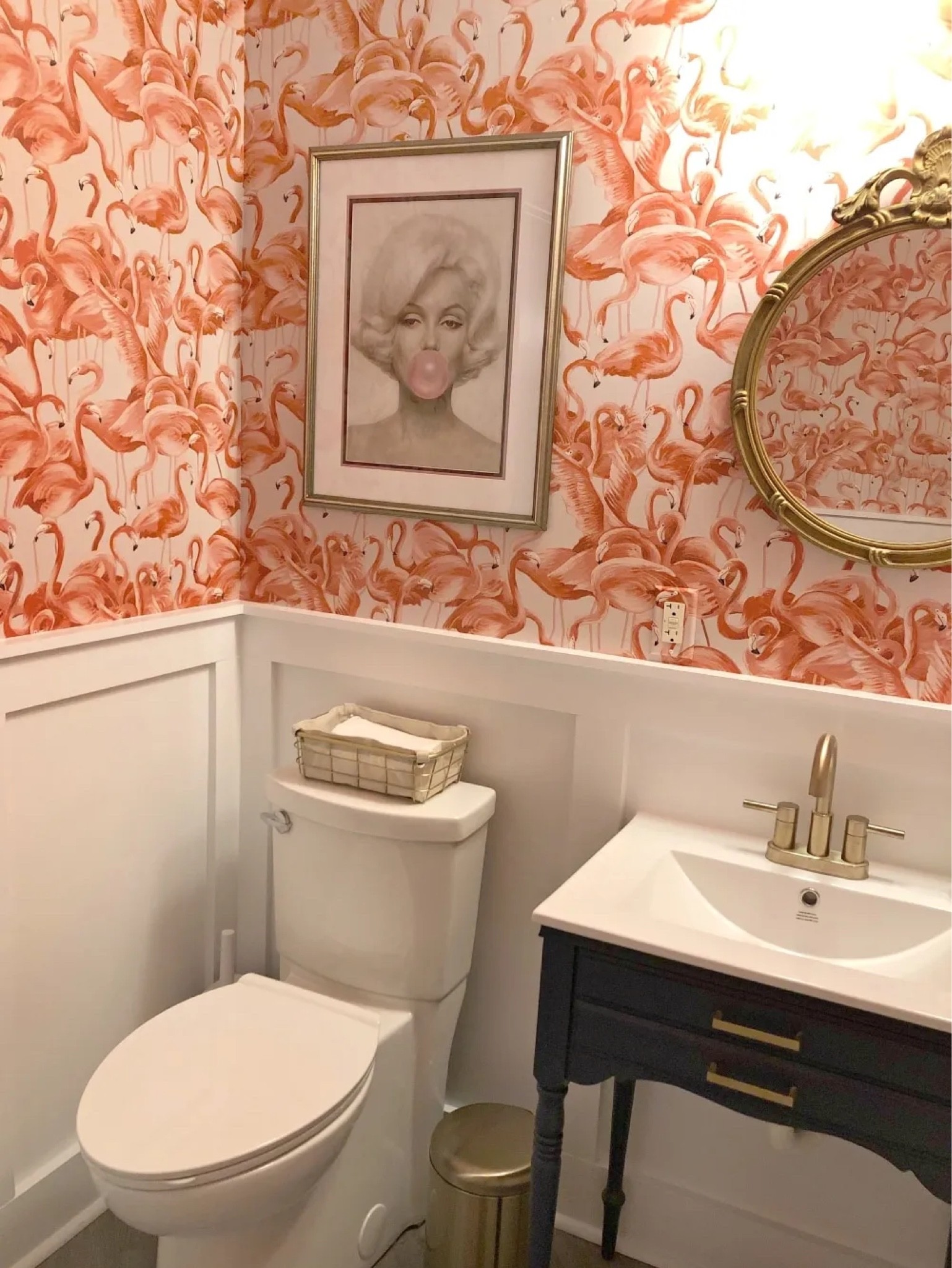 Flamingo wallpaper, powder room, pink bathroom, blue vanity. Marilyn Monroe print, clean toilet, board and Batten, gold faucet, good vanity light, gold garbage can


#LTKhome