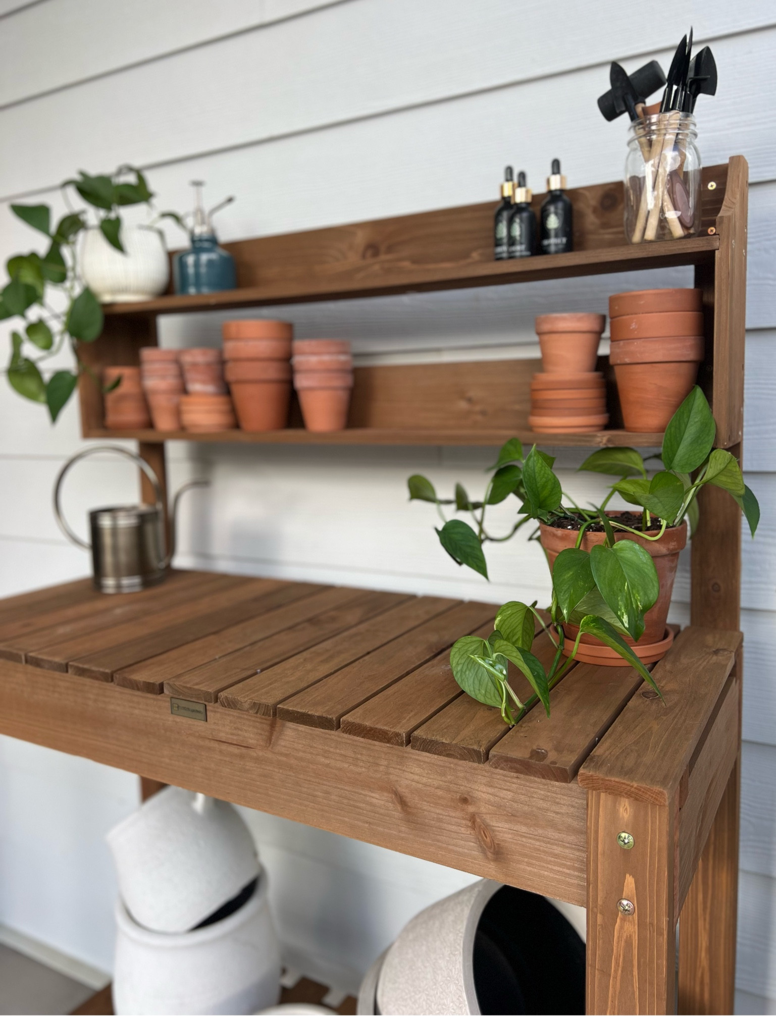 I finally got myself a potting bench and I’m so excited about it! It’s super cute and perfect for propagating or repotting all my plant babies! It was a great price point and I love the size and that it has wheels and a dirt bucket! Perfect for my patio!

#LTKHome #LTKStyleTip #LTKSeasonal