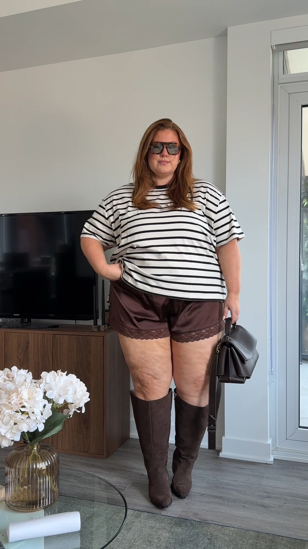 Plus size transitional fall outfit! My feed has been full of these little satin lace trim shorts and cute tees and sweaters. I searched high and low for a plus size alternative option and landed on pajamas from old navy hahah.. but they work!! 

Bag is Polene
Boots are NEW Dolce Vita launching 09/03!!

Brown satin pj set- 3X
Good American stripe tee-3X

#LTKcurves #LTKmidsize #LTKplussize