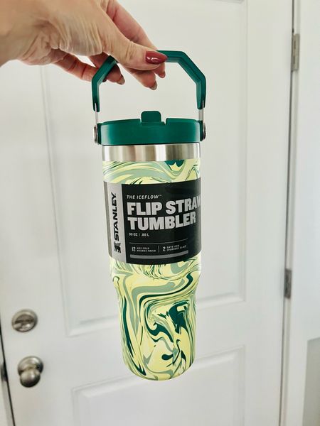 Cute Stanley ! Great teen gift for christmas. My friend got this for her daughter. Loved the fun green colors and swirls. This is the popular flip straw version. 

Built-in straw for easy drinking . Snap it shut and the insulation will keep your drink fully leakproof and extra cold for hours. 

It fits in your vehicle’s cup holder (treadmills and spin cycles, too!), and the folding handle lets you quickly grab and go.

The IceFlow Tumbler is made with recycled plastics sourced from discarded fishing nets, sparing our waters of plastic waste. #sustainability #ecofriendly #stanley #stanleycup #stanleytumbler 

#LTKFind #LTKkids #LTKunder50
