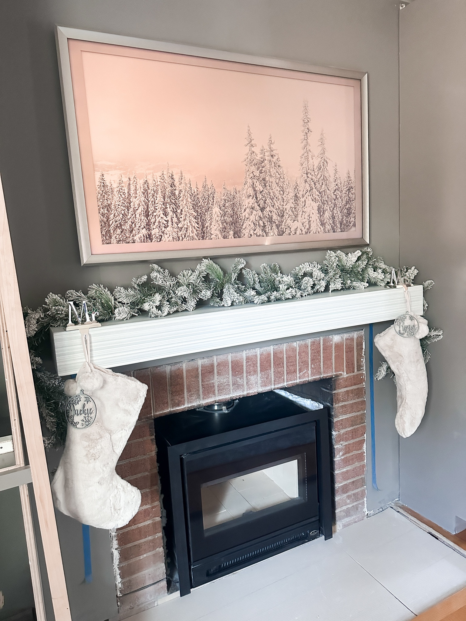 Flocked garland/ stockings/ stocking holder/ frame tv/ mantle 

#LTKhome #LTKfamily #LTKSeasonal