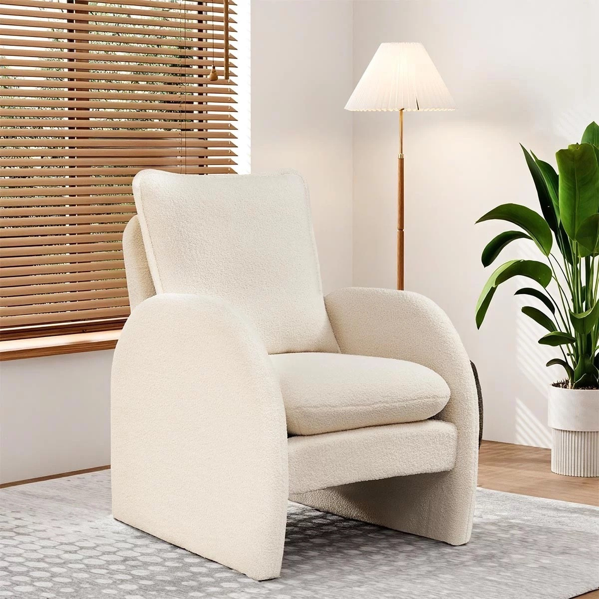 Your new cozy corner essential 🤍 This modern boucle armchair is the perfect mix of comfort and style — pair it with a floor lamp and a touch of greenery for that effortless, chic vibe. 