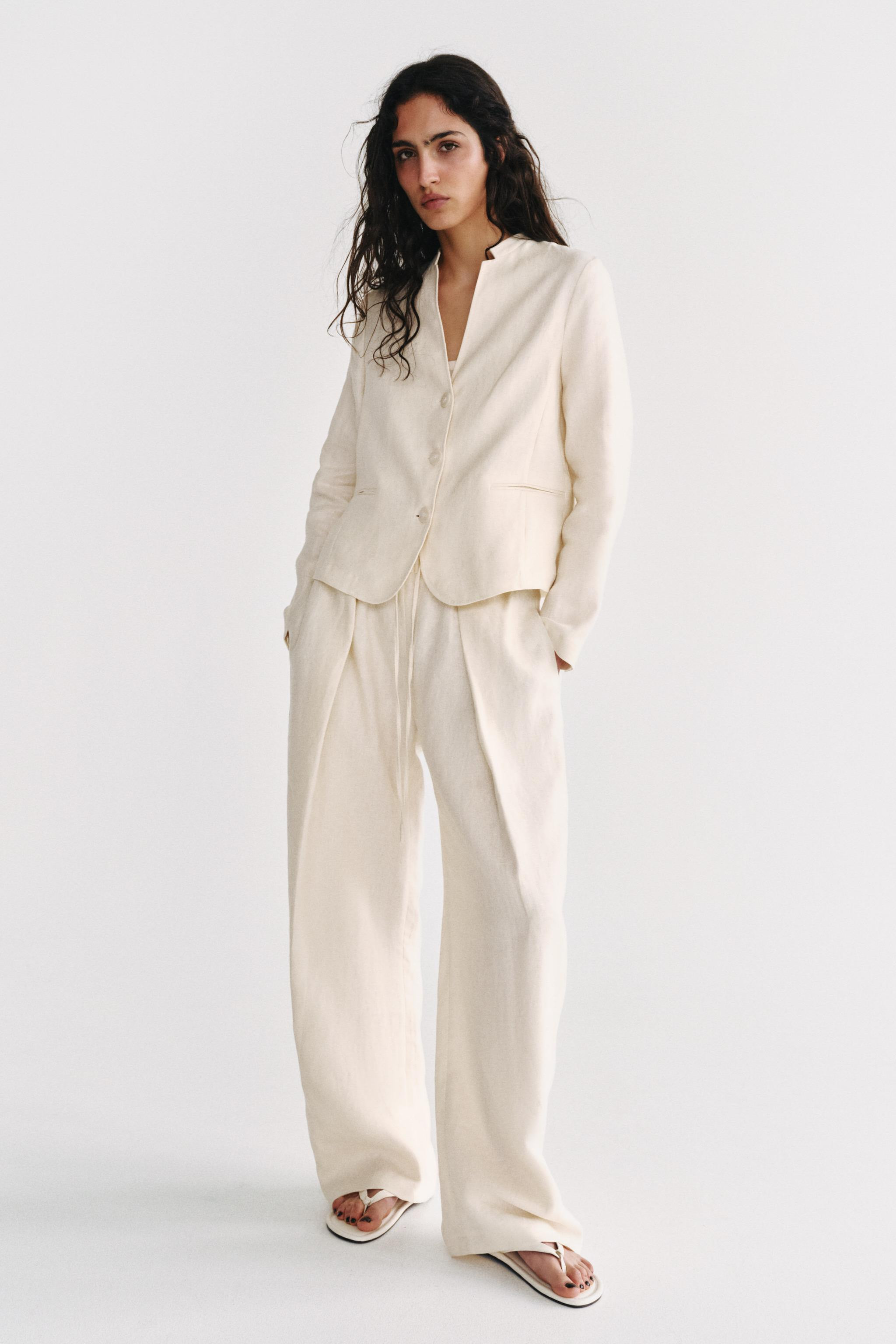 Model height: 178 cmZARA WOMAN COLLECTION. Trousers made from linen yarn. Mid-waist with an adjus... | Zara UK