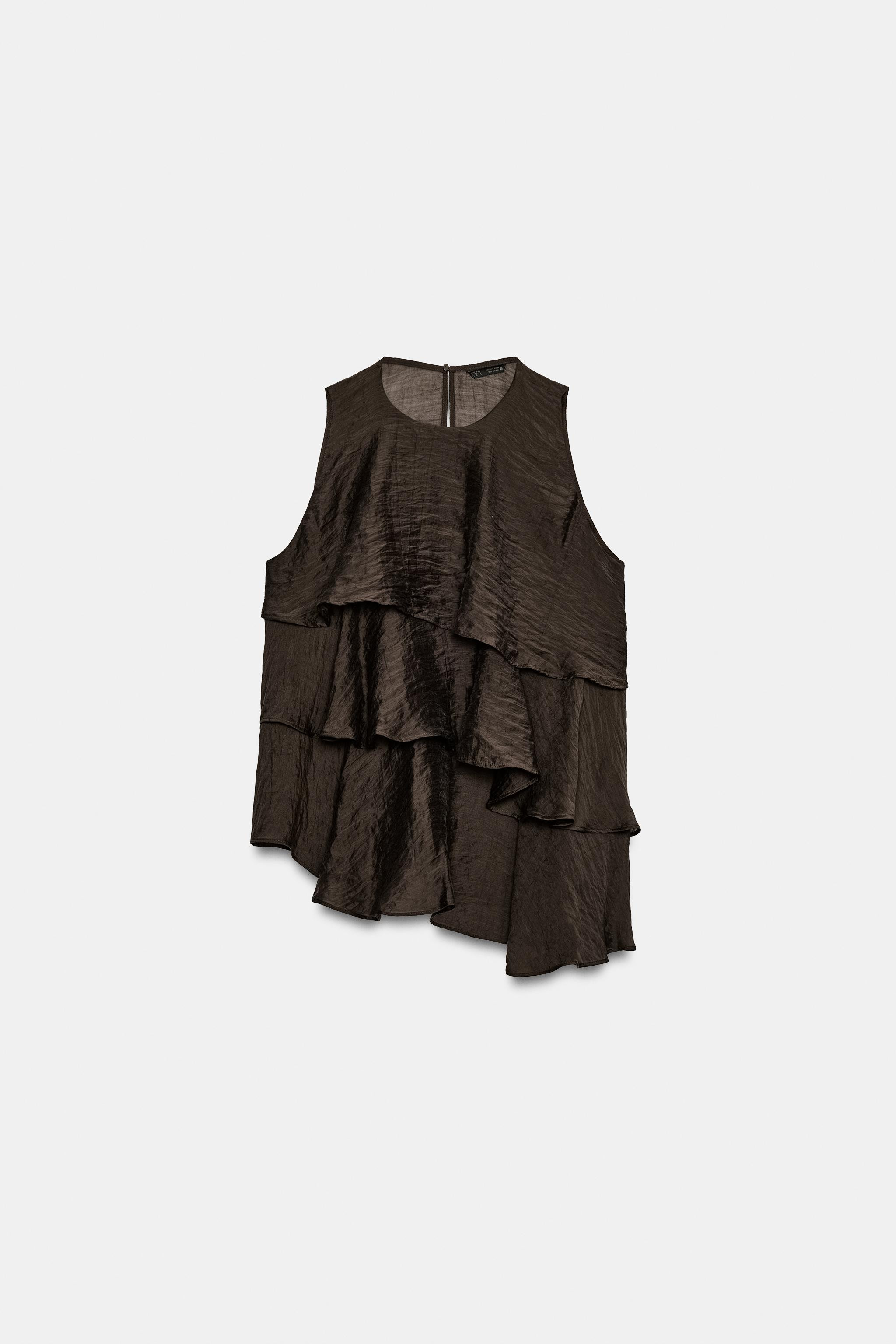 Model height: 177 cmRound neck and sleeveless top. Features ruffled details and an asymmetric hem... | Zara DE