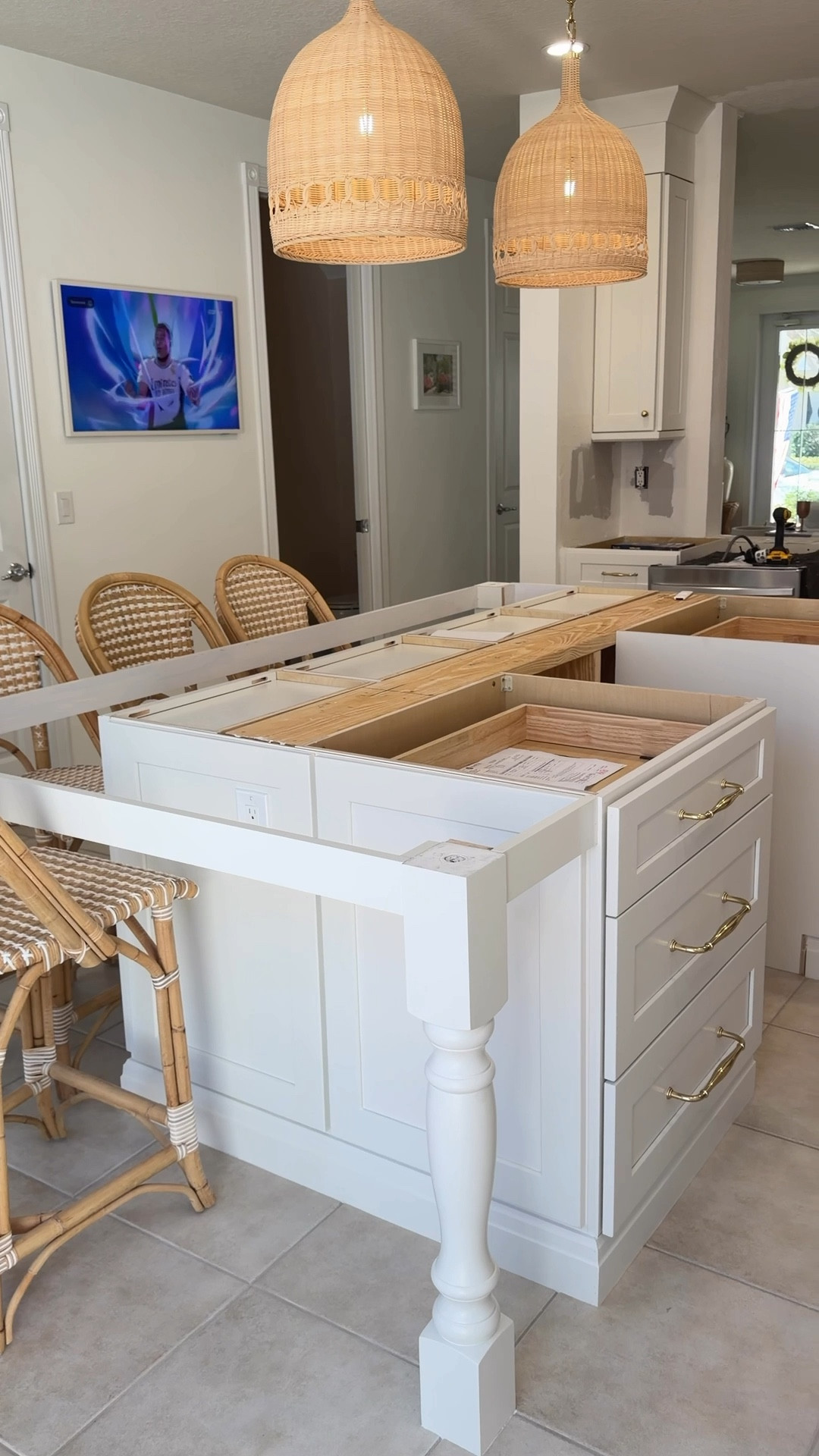 Kitchen renovation details: Polished Brass Hardware, Rattan Pendant Lights + Counter Stools

#LTKHome