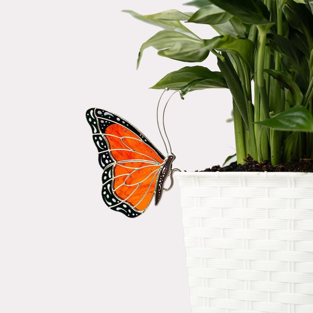 Add a splash of color and artistry to your favorite spaces with this stunning handcrafted Monarch Butterfly Stained Glass Suncatcher from VitrageArtSouvenirs. Its vibrant wings and intricate detailing make it a beautiful accent for planters, windowsills, or any nature-themed décor. Perfect for gifting on Father’s Day, Mother’s Day, or any occasion, this elegant piece brings a serene, whimsical glow to both indoor and outdoor settings. A thoughtful way to celebrate someone who loves gardening, butterflies, and meaningful handmade art. #StainedGlassArt #ButterflySuncatcher #GardenDecor #EtsyFinds #HandmadeGiftIdeas #NatureInspiredDecor

#LTKGiftGuide #LTKHoliday #LTKSeasonal