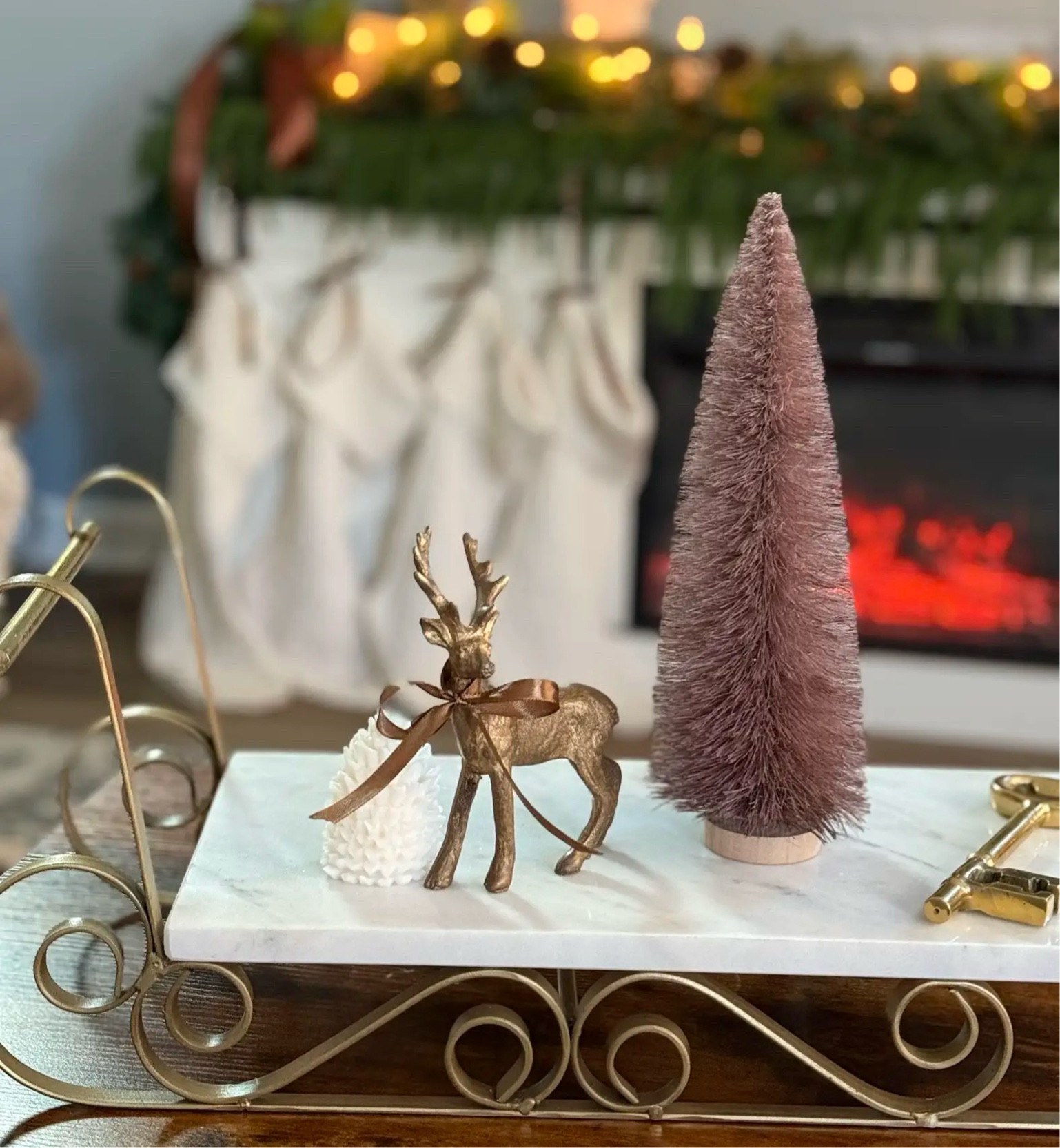 Golden touches for a cozy holiday ✨ This sleigh with gold and ivory accents, a charming gold reindeer, and a brown bottle tree brings warmth and elegance to your seasonal decor. Shop the look now! #LTKHoliday #TimelessDecor
Creating a warm and inviting holiday display is all in the details. This beautiful sleigh with gold and ivory accents steals the show, complemented by a petite gold reindeer and a textured brown bottle tree. It’s the perfect blend of elegance and charm to elevate your Christmas decor. Whether for a centerpiece or a cozy nook, this setup brings a timeless holiday glow. Tap to shop these festive finds and recreate the look in your home!

#LTKSeasonal #LTKHoliday #LTKGiftGuide