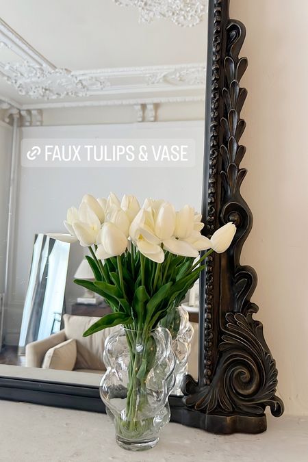 Faux tulips, glass vase, black primrose mantle mirror 

#LTKhome #LTKsalealert #LTKFind
