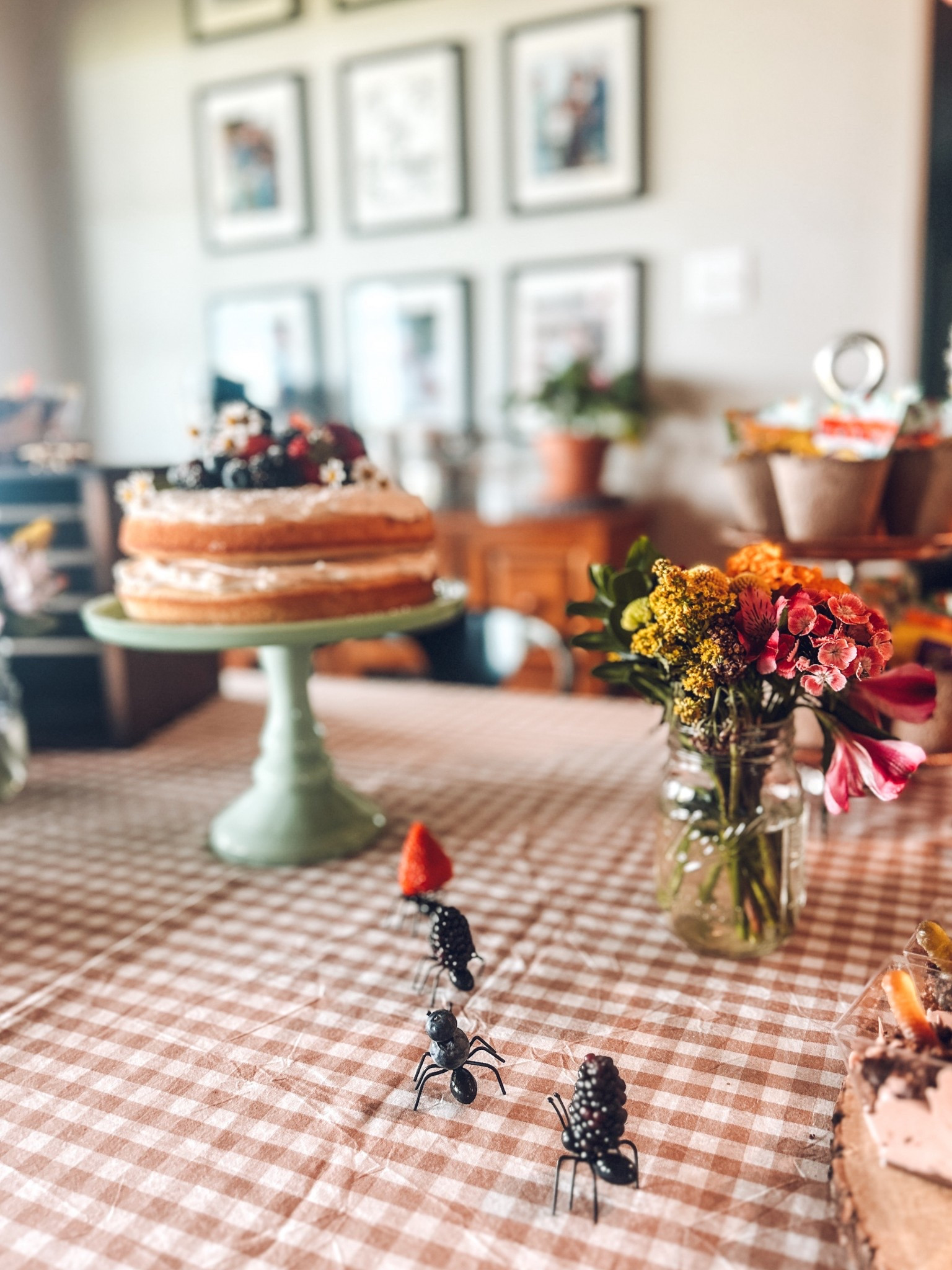 Garden party dreams come true with these whimsical details! 🐜✨ How adorable are these ant food picks carrying little berries? They add the perfect playful touch to a garden-themed birthday or baby shower. The naked berry-topped cake, fresh florals in mason jars, + planter favor cups bring the whole tablescape together with charming, rustic vibes. Perfect for spring or summer gatherings! 🌸🍓🌿 #GardenPartyDecor #WhimsicalPartyIdeas #LTKKids #LTKPartyPlanning #BugThemedParty #OutdoorEntertaining #LTKBabyShower

#LTKParties #LTKKids #LTKSeasonal