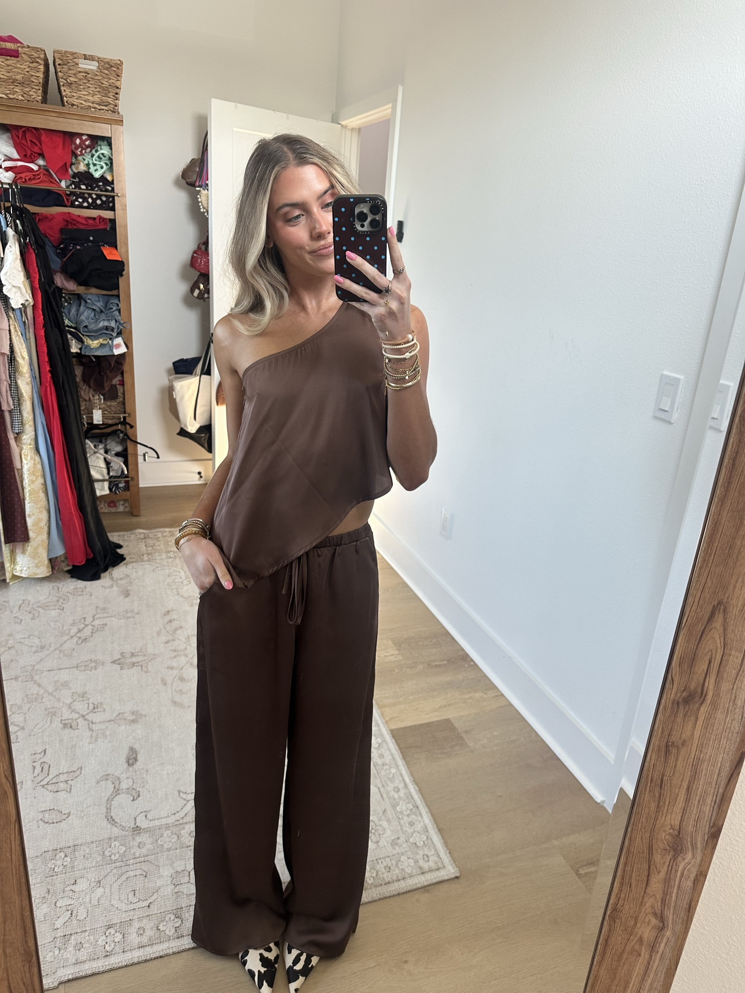 Outfit for the night! size XS pants and top my code is SLOANEV10. 
Chic never looked this easy. The Estelle Espresso Top with a one shoulder neckline and asymmetrical silhouette is made to move with you. Pair with the matching Estelle Espresso Pants for a head-turning set, or style solo with a tank or tee for elevated off-duty vibes. Chic never looked this easy. The Estelle Satin Pant flows with a wide-leg silhouette in rich espresso satin—made to move with you.Pair it with the matching Estelle Espresso One Shoulder Top for a head-turning set, or style solo with a tank or tee for elevated off-duty vibes  @12th Tribe   my bag is @Leatherology 

#LTKSaleAlert #LTKootd #LTKSeasonal