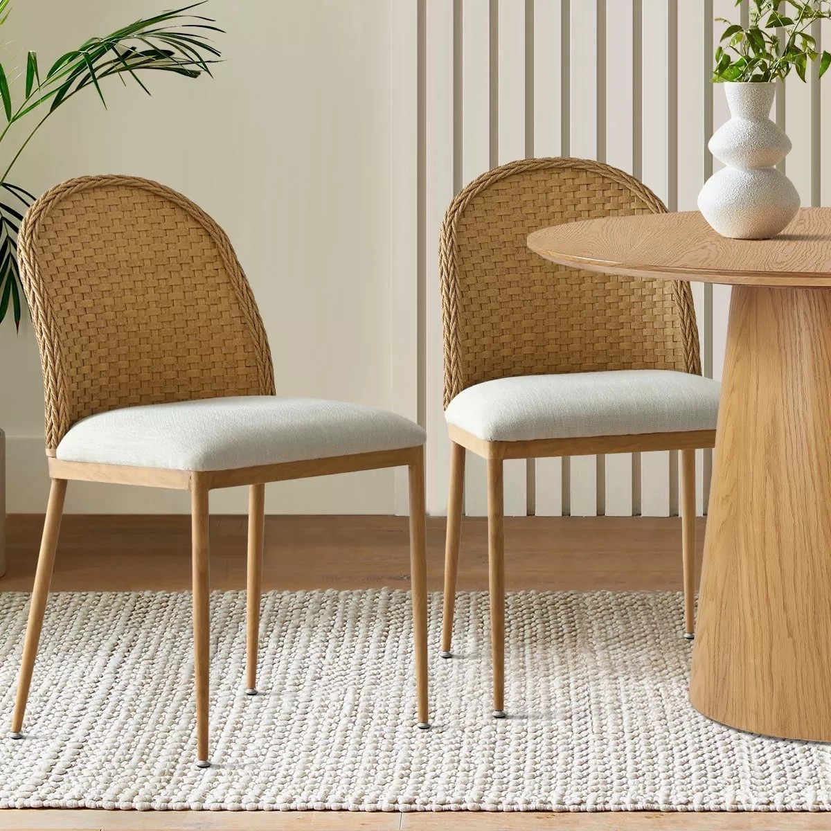 Bring a touch of natural warmth and modern style to your dining space with these woven rattan back chairs featuring sleek wooden legs and a soft cushioned seat. Perfect for pairing with round or rectangular tables, they add a cozy yet refined feel to any home.