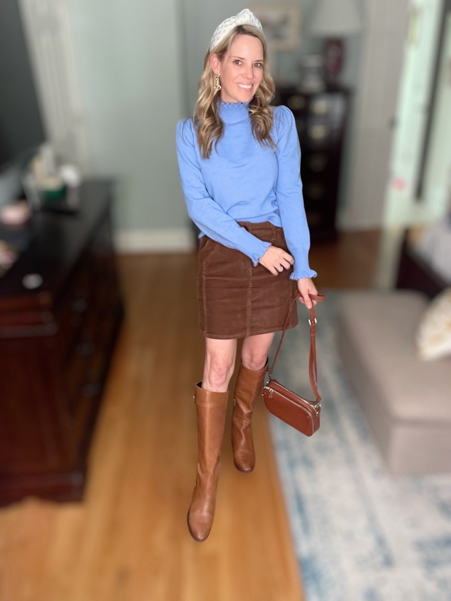 💙🤎 The perfect mix of cozy and classic! I paired this soft ruffle mock neck sweater with a brown corduroy mini skirt for a timeless fall outfit that feels chic but easy to wear. Tall leather riding boots add a polished touch, while the crossbody bag keeps it casual and practical. The pearl-embellished headband and gold horsebit earrings give the look just the right amount of sparkle. ✨

✔️ Amazon ruffle sweater under $35
✔️ Walmart corduroy mini skirt under $20
✔️ Classic Sam Edelman riding boots you’ll wear for years
✔️ Affordable statement accessories to finish the look

This outfit is perfect for fall gatherings, Thanksgiving style, or everyday chic. A modern twist on preppy classics that never go out of style! 🍂

#FallOutfitInspo #PreppyStyle #FallFashionTrends #OOTD #ChicAtAnyAge


#LTKOver40 #LTKFindsUnder50 #LTKFindsUnder100