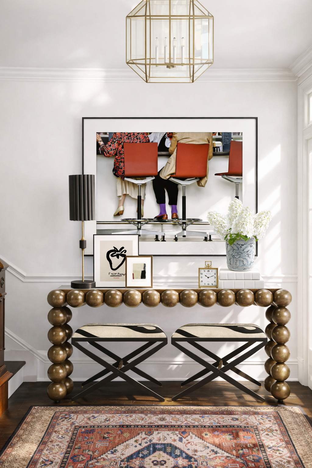 This entryway proves you don’t need a huge space to make a statement.

A sculptural brass console, classic benches, layered art, and a vintage-style rug instantly create that collected, designer look the moment you walk in.

Every piece here works hard — beautiful, functional, and timeless.

Shop the pieces I used to create this look. 

 #LTKHome
