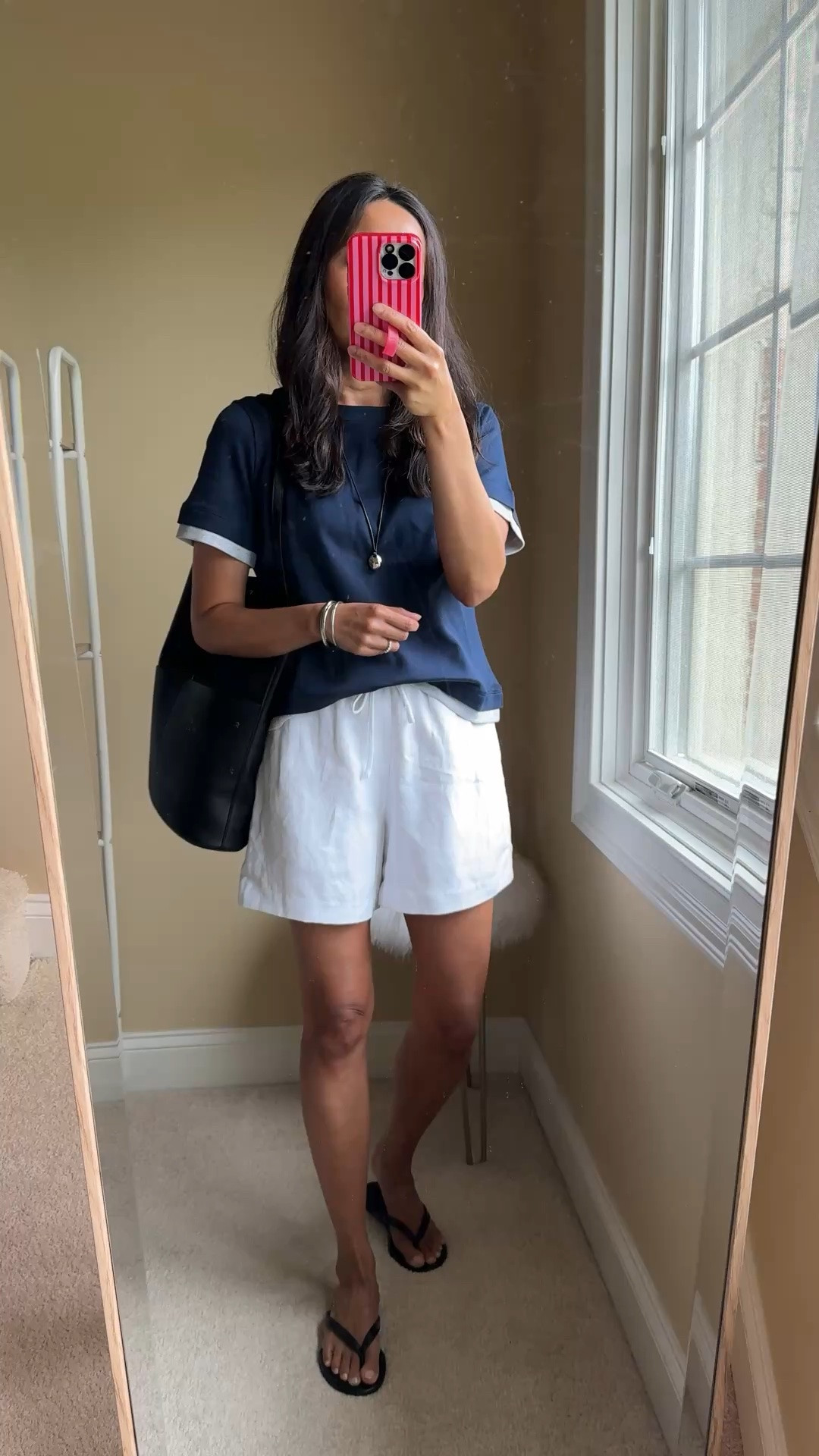 Navy / White / Silver summer combo with elevated basics. 
- I used to always choose black over navy, but have grown to really like a good dark blue piece. It looks chic with cool crisp whites, grays, and silver. 

- Exact top is an updated version of one of my favorite cotton t-shirts. Multiple colors also available. I size up. 
- Exact shorts are a nice elevated, but comfy linen blend option. Good option to dress up if needed. Multiple colors also available. True to size. 
- I have been eyeing pendant necklaces of this style. I like this smaller style which makes a subtle statement. 
- Matching black bag and sandals to finish.

#LTKootd #LTKOver40 #LTKTravel