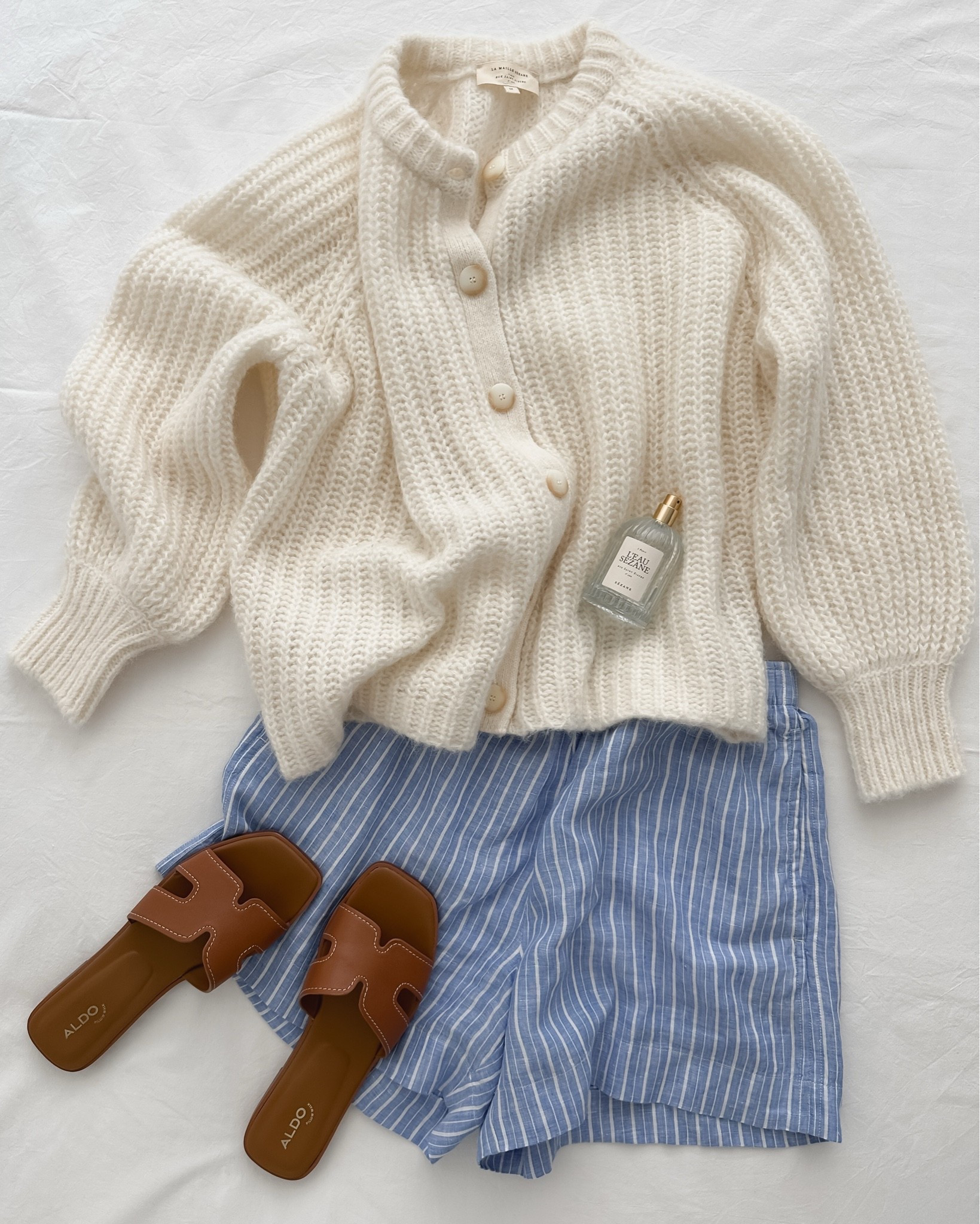 Summer, in the details.

Blue-and-white linen stripes, soft knitwear, buttery camel leather, and a delicate blend of citrus, florals, and musk.

The kind of pieces that make getting dressed feel easy ☀️
@SEZANE #perfume #coastalfashion # coastal fashion

#LTKstyletip #LTKsummer