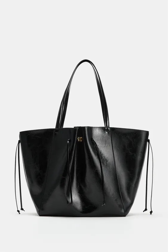 Shopper style shoulder bag. Featuring gathered detail and straps with metallic hardware on the fr... | Zara US