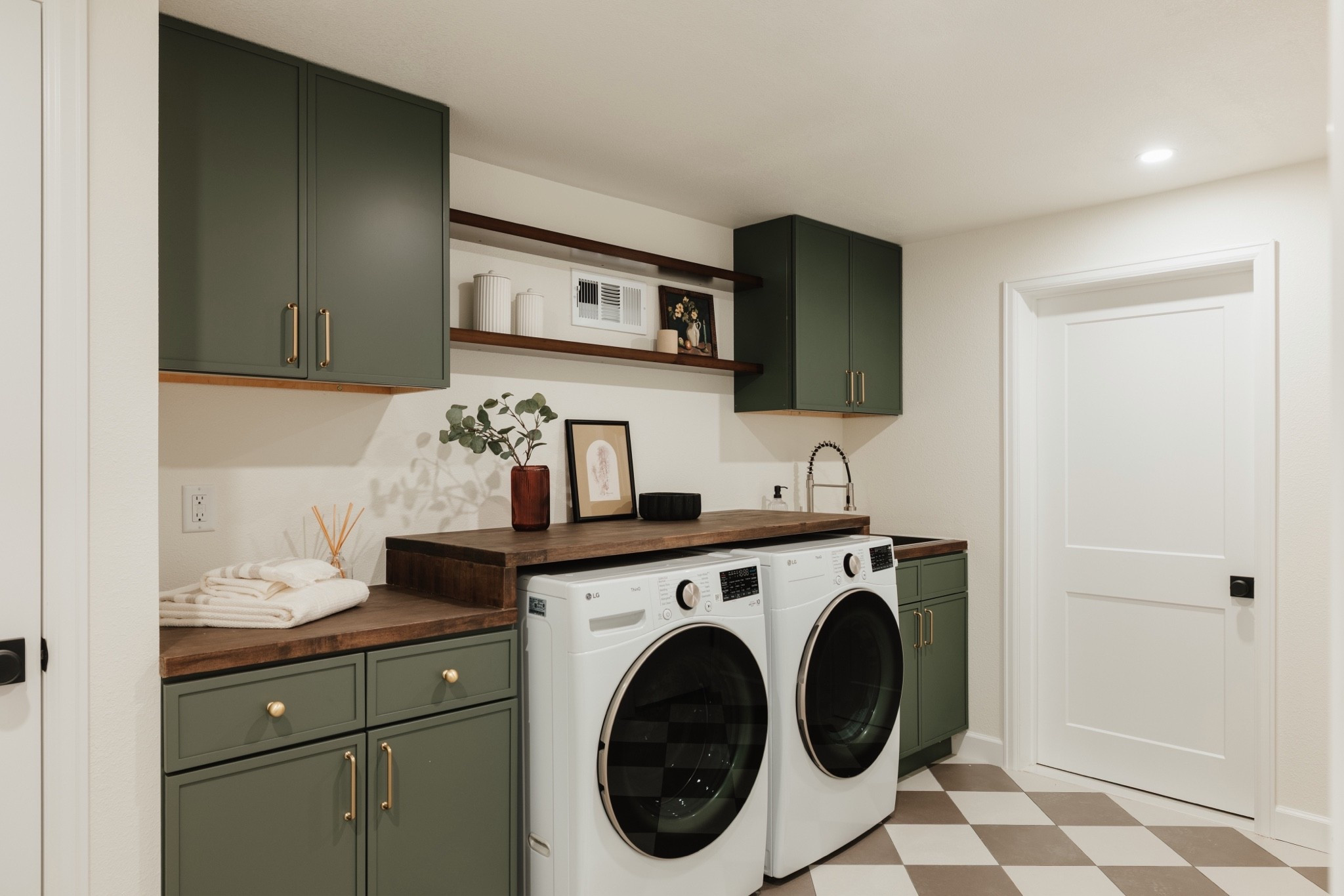 Laundry featuring green cabinets and classic checkerboard floor

Laundry room, washer, dryer

#LTKHome