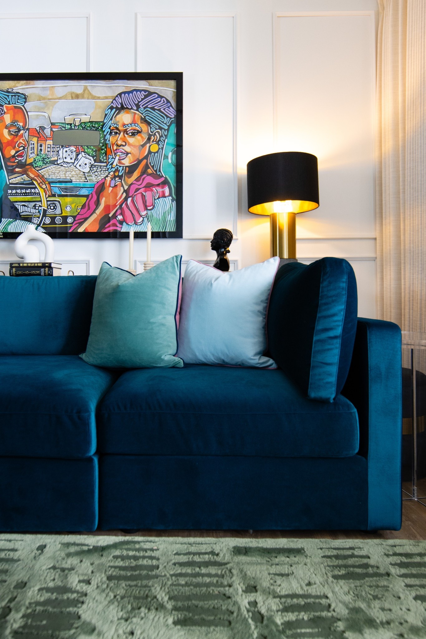 Apartment living room with blue sofa 


Velvet sofa, gold table lamp, black art, wall moulding, Amazon decor, accent pillows 

#LTKHome