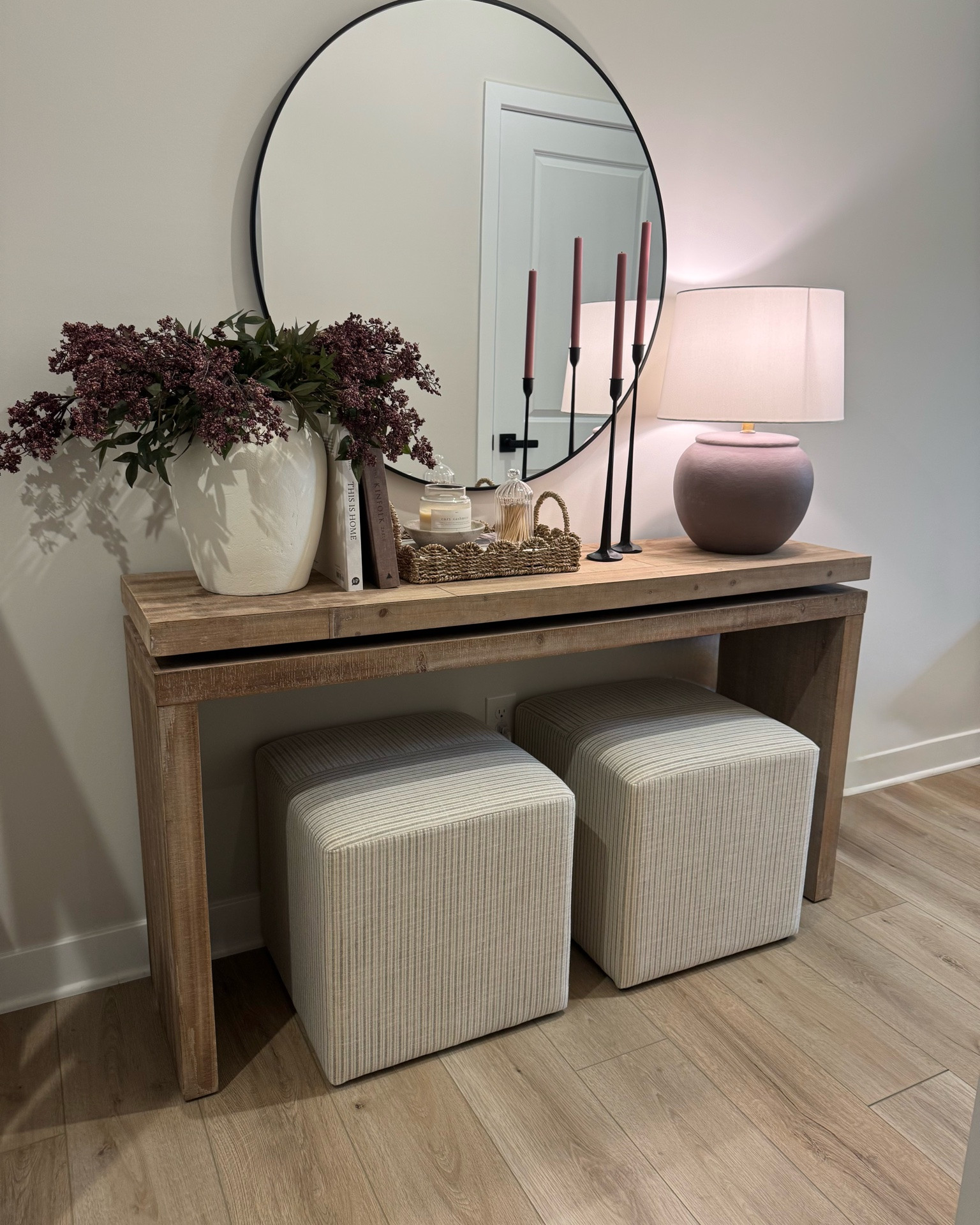 Berry stems, white vase, scallop tray, candle bowl, console table styling, coffee table books, round mirror

#LTKSeasonal #LTKHome #LTKSaleAlert