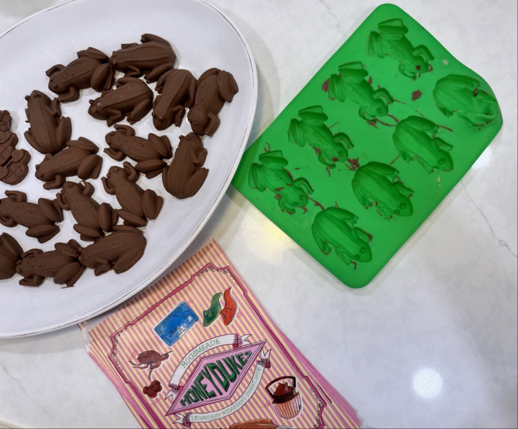 DIY Chocolate Frogs for Harry Potter Fans 🍫🐸

We made our own chocolate frogs at home, and they turned out so fun. I used these green silicone molds, poured in melted chocolate, and popped them in the fridge for a quick set. They come out with all the little details, so they look just like the ones from the Wizarding World.

I also ordered Honeydukes paper confectionary bags to pack them up for gifting. The bags make them feel extra magical for parties, movie nights, or little treats for friends.

Such a simple project that feels straight out of Hogsmeade.

#HarryPotter #ChocolateFrogs #DIYTreats #Honeydukes #WizardingWorld #LTKhome #Chocolates #Baking 

 #LTKmomlife #LTKfoodie #LTKKids