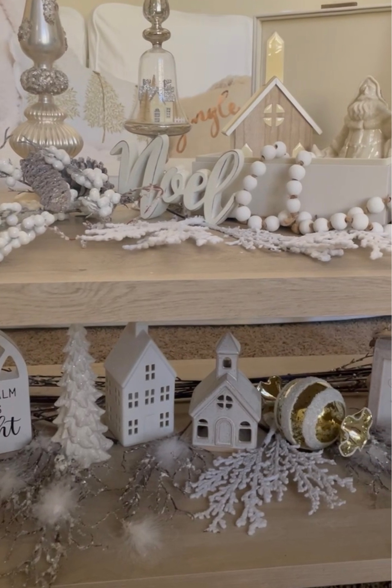 Beautiful neutral and natural coffee table display. We used trees, churches, signs, snowy picks and candles  

#LTKHoliday #LTKhome #LTKSeasonal