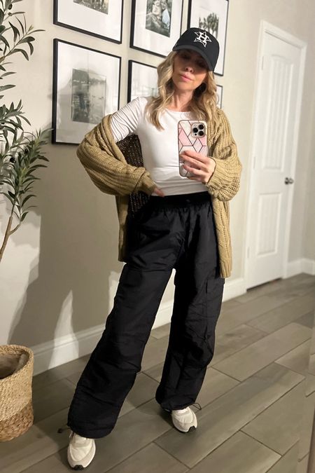 These parachute cargo pants are lightweight and perfect for a comfy and sporty look. I wore them to a dance class and they were super comfy! I styled it with this basic white square neck top -backwards for a sportier look. I threw on a cardigan for warmth and added texture! These are my favorite Nike sneaks lately! 

#LTKstyletip #LTKMostLoved #LTKSeasonal