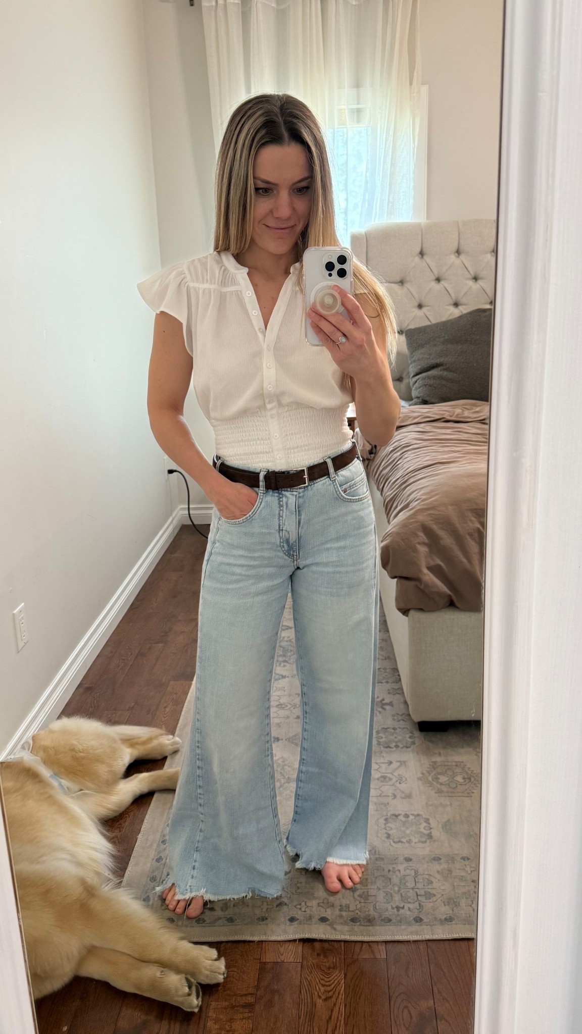 Jeans fit big! I sized down from a 26 to a 24, and still have room. I have the blouse in pink too and love it! Blouse is true to size. Wearing a small.