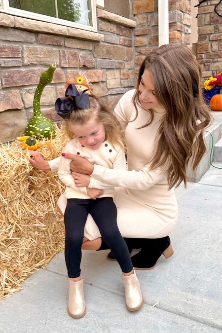 Mom-and-daughter moment! We love our matching neutral sweaters and Fall booties! 

#ShoptheLook #FallOutfitInspo #FamilyPhotoshootIdeas #KidsFallOutfits

#LTKfamily #LTKstyletip #LTKSeasonal