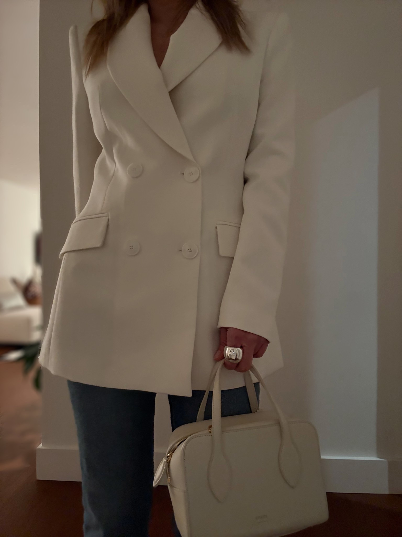 Part of my outfit Saturday night. I wore an ivory colored double-breasted oversized blazer (we’ll call it cloud dancer since that’s the 2026 Pantone color of the year) w a pair of straight leg medium wash jeans and cobalt blue heels. My accessories here are a puffy silver dome ring and a small top handle ivory bag.

#LTKWorkwear #LTKSeasonal #LTKootd