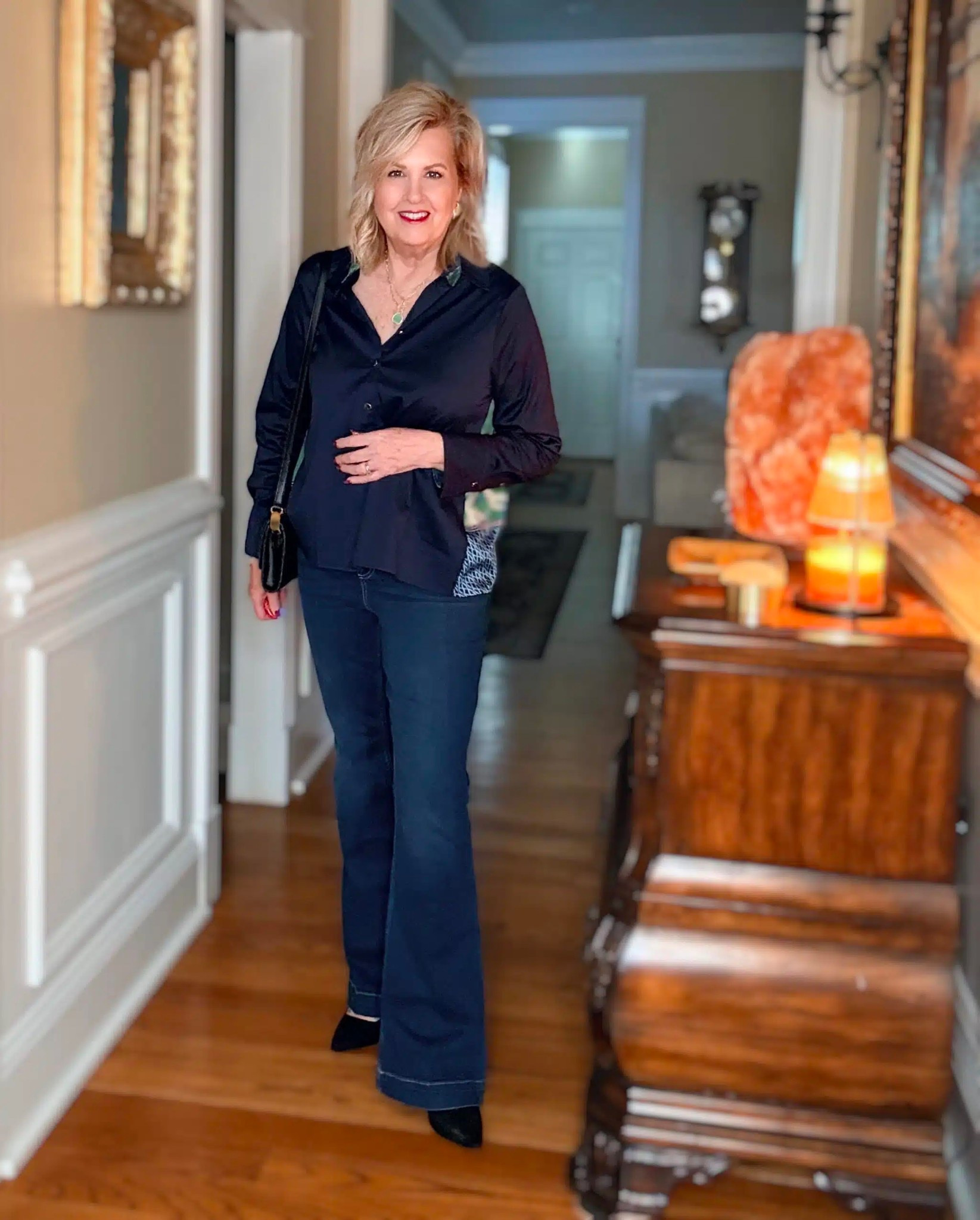 This navy blouse is a classic piece, but the nautical print on the back gives it a fun twist. My top is a size 1 | flare jeans size large 

#LTKWorkwear #LTKootd #LTKOver40