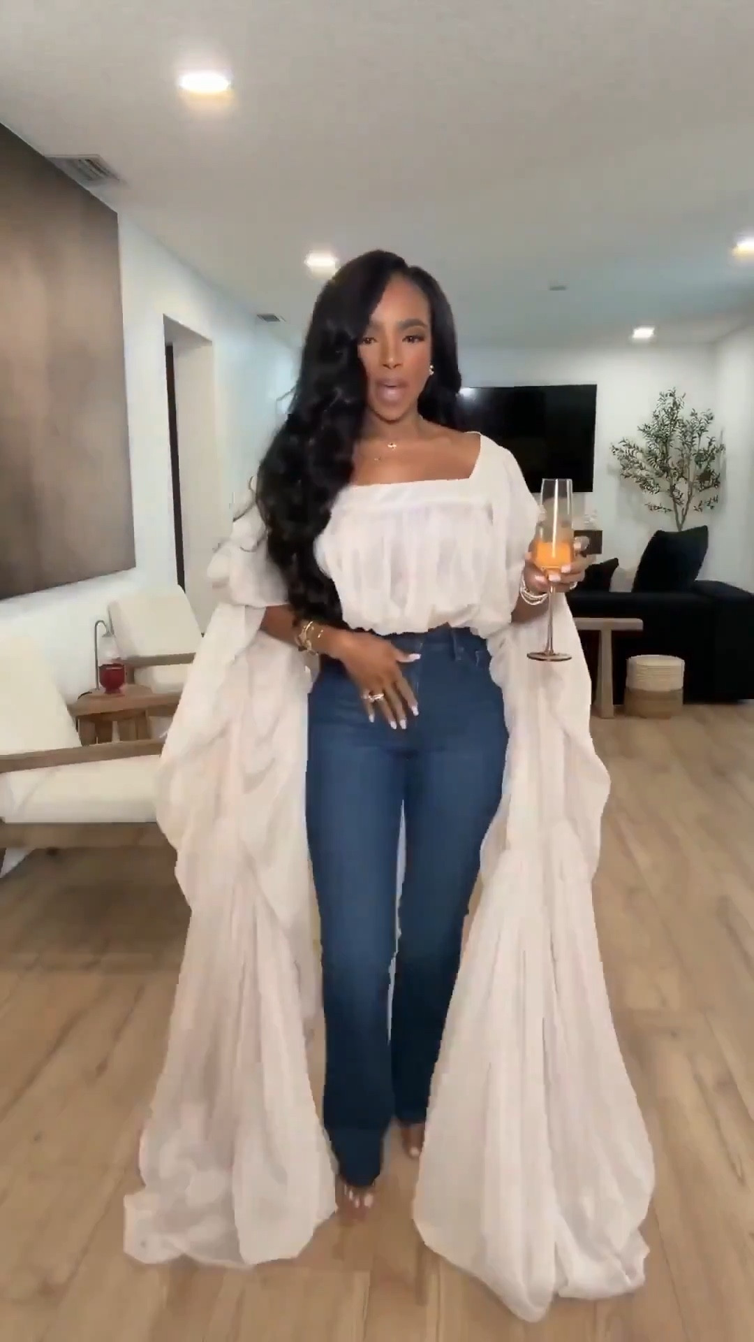 When your basics meet drama in the best way 🤍 This flowing neutral duster layered over a soft off-shoulder blouse and dark wash denim creates the most effortless elevated look. Styled multiple ways, this long statement layer instantly transforms simple staples — and that’s exactly how your cost per wear drops.

Perfect for: dinner at home, hosting nights, vacation evenings, brunch, girls’ night, or an elevated casual date night.

Save this post and build around timeless denim — this is a long-term shopping strategy outfit that proves you don’t need a full gown to create impact.

Sizing:
Duster: Size Small  
Top: Size Small  
Jeans: 27 Long  
Heels: True to size  

Measurements: 5’4” | 138 lbs | 34D bust | 27” waist | 40” hips  

This neutral layered outfit features a flowing maxi duster, off shoulder blouse, dark wash denim, elevated casual styling, chic hosting outfit inspiration, vacation dinner look, feminine layered fashion, and versatile wardrobe staples designed to maximize cost per wear.

Follow me on Instagram and YouTube @kirasfashionfinds