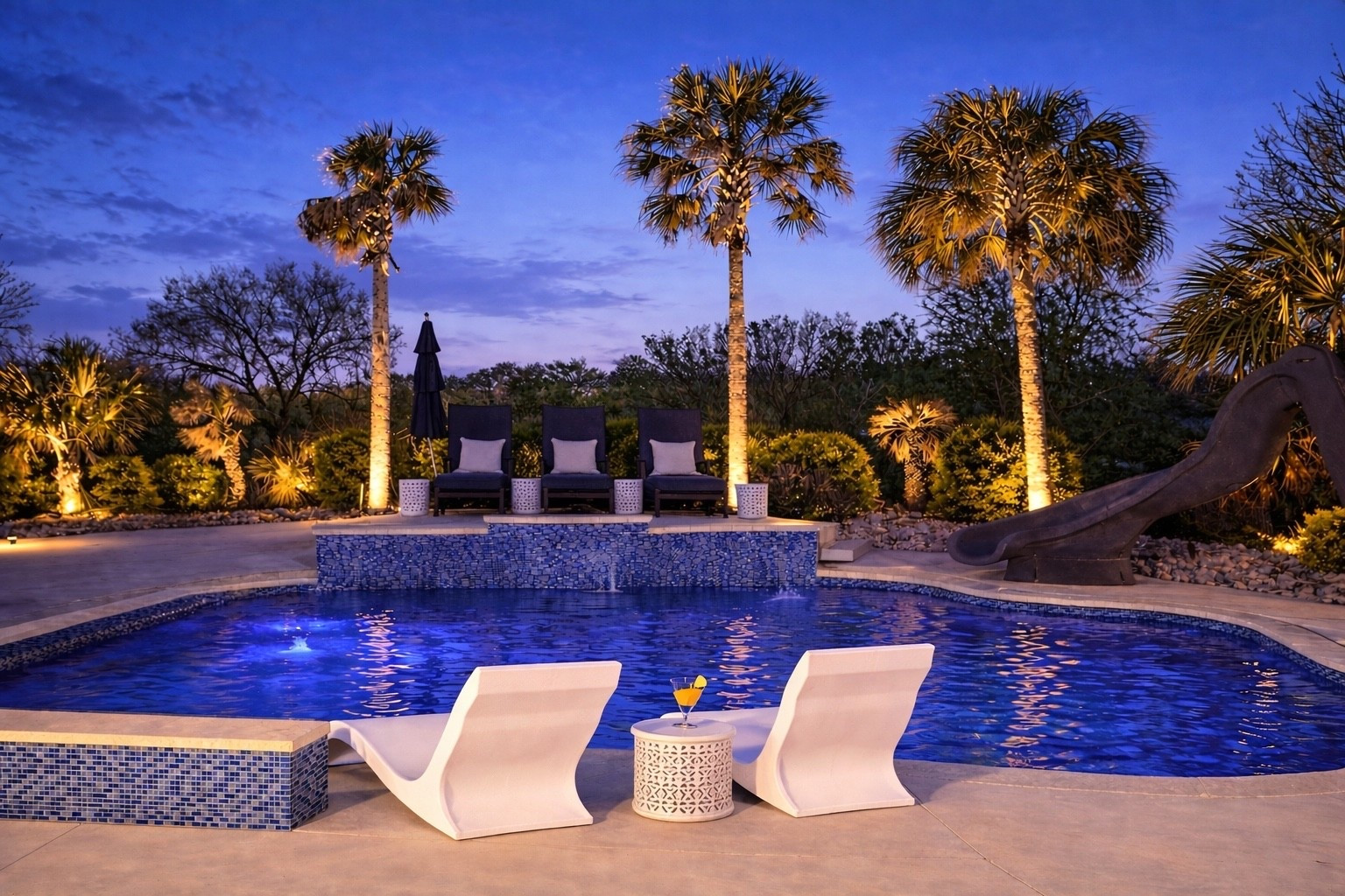 Creating a space that feels as good as it looks.
The navy loungers and side tables have quickly become our favorite spot to unwind at the end of the day—comfortable, timeless, and made for relaxing by the pool.
 #BackyardRetreat #PatioLiving  #LTKSeasonal #OutdoorSpaces 