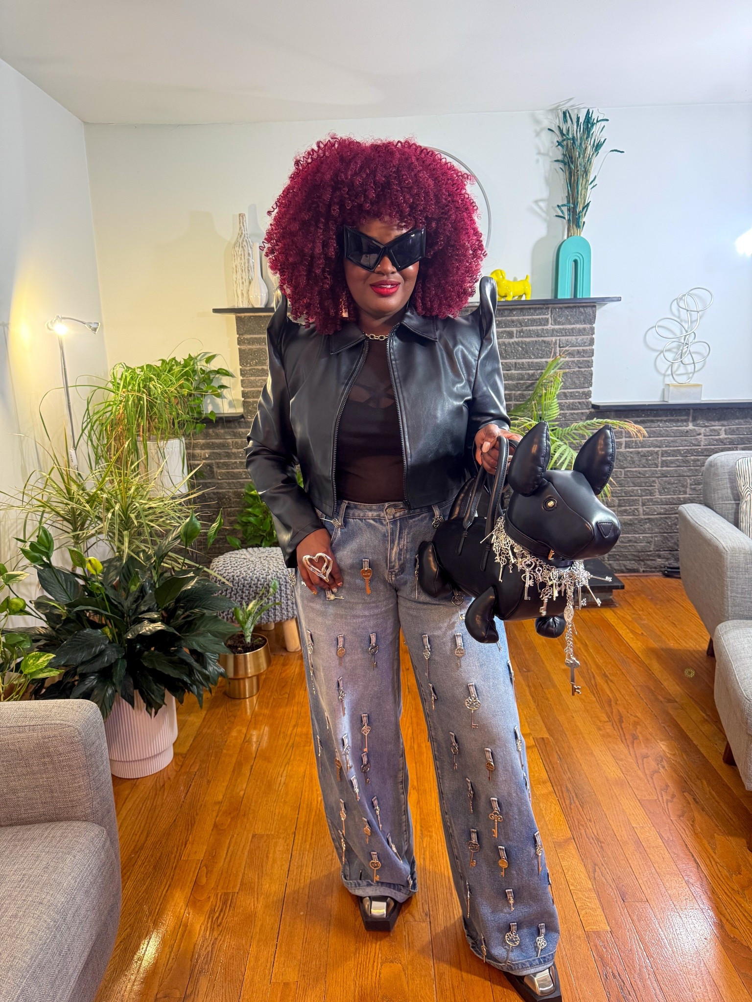 On Day 4 of New Haven Fashion Week, I rocked a look that was all about the details. It started with the show-stopping shoulders on my jacket and flowed down to jeans adorned with keys. The metal-capped toes on my boots added a fierce edge. Naturally, I couldn't resist wrapping a quirky key belt around my dog-shaped purse to complete the look!

#LTKMidsize #LTKStyleTip